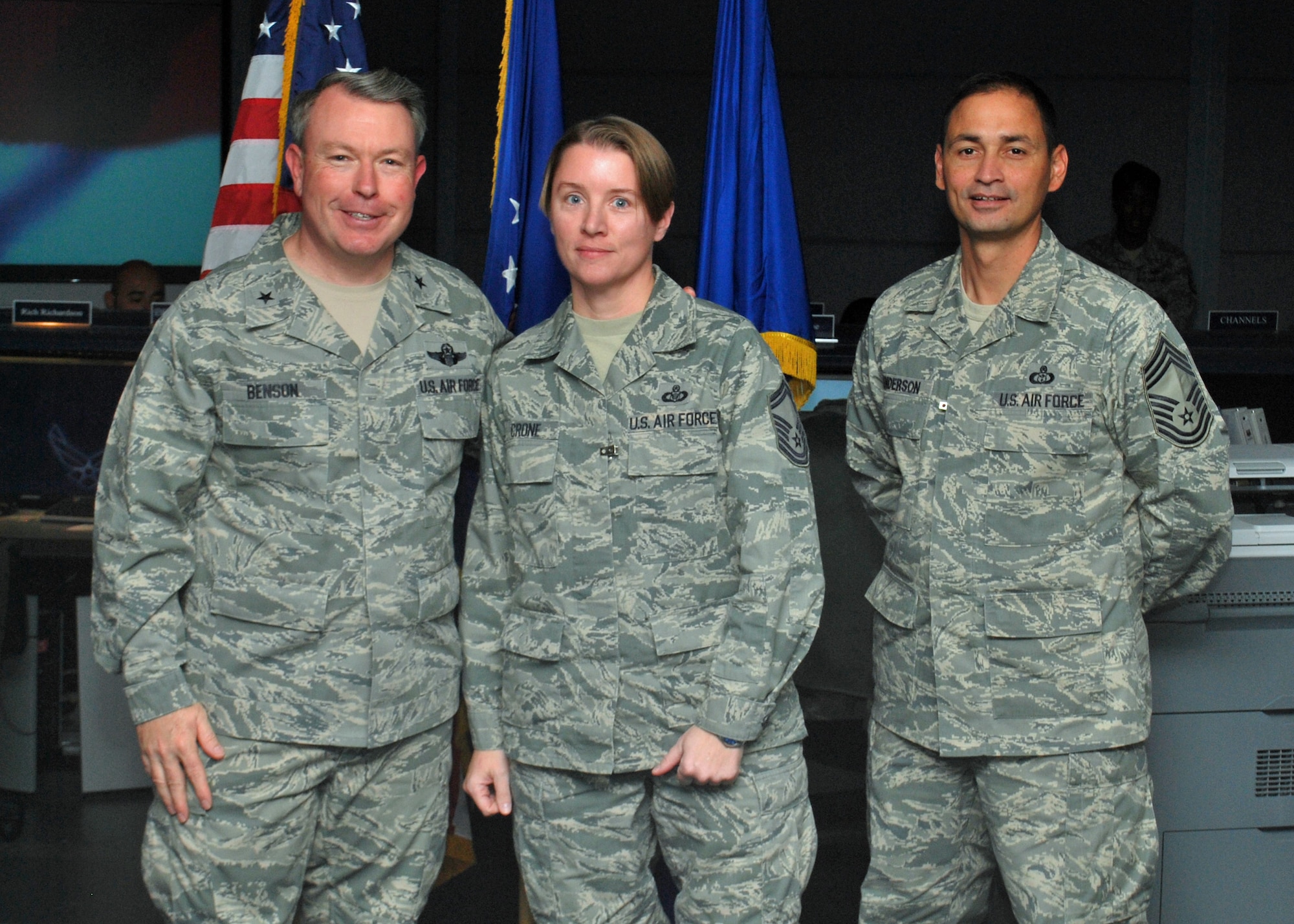 Senior Master Sgt. Donna Crone, pictured here with Brig. Gen. Bryan Benson, 18th Air Force vice commander, and Chief Master Sgt. Andrew Henderson, 618th Air and Space Operations Center superintendent, was named Air Force Reserve Command’s 2010 Outstanding Individual Reservist of the Year for the senior non-commissioned officer category in an announcement Nov. 17.  Sergeant Crone is the 618th AOC’s Director of Operations superintendent and her award, part of the Air Force Reserve Command’s annual awards program, recognizes the top senior NCO reservist for his or her contributions to the Air Force mission.  (U.S. Air Force photo/Capt. Justin Brockhoff)