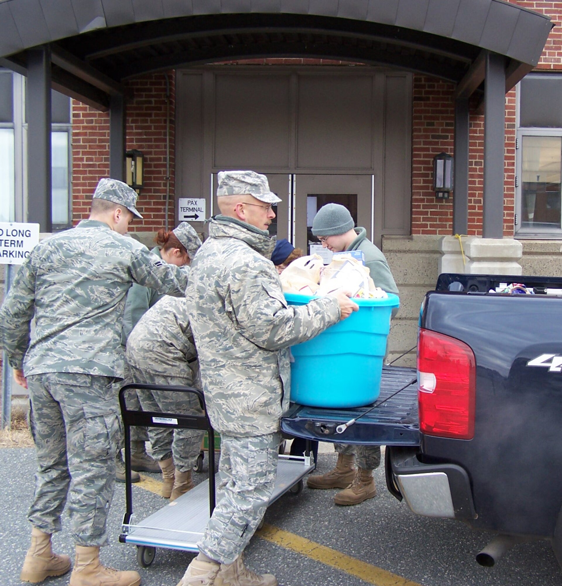 Master Sgt. Timothy Day, 439th Maintenance Squadron, and a member of Westover's Top 3, loads donated food into a truck at Westover Dec. 6. Top 3 members collected 300 pounds of donated food and delivered it to Lorraine's Kitchen. (Courtesy photo)Chicopee.  We met Lorraine, nice lady.  Turns out they accept clothing aswell.  Great operation there.