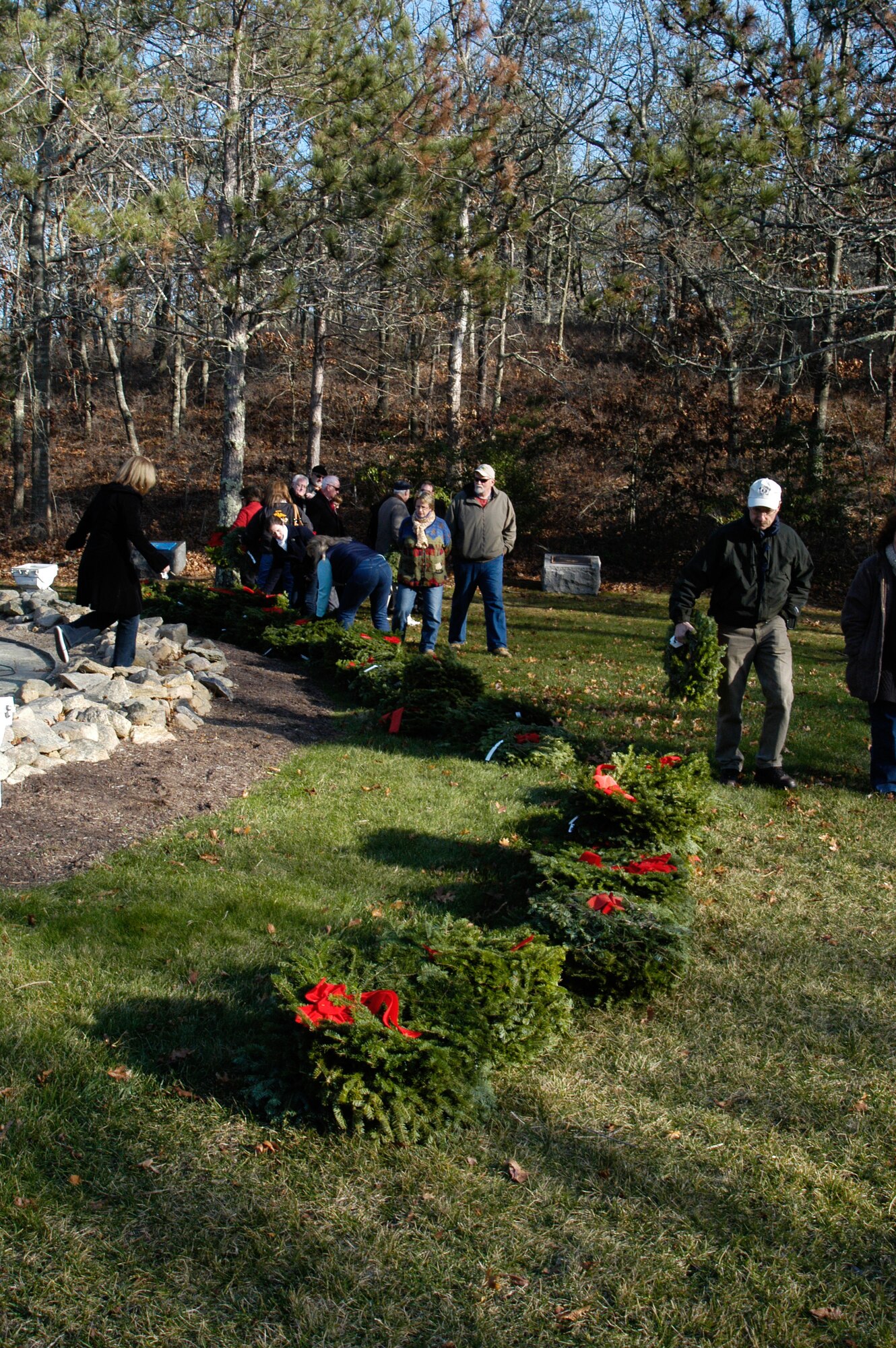 On December 11, 2010 military members, civilians and volunteers gathered for a solemn tribute to honor veterans in the annual Wreaths Across America ceremony held at the Massachusetts National Cemetery on Cape Cod. This year 3,600 wreaths were sponsored for the event which is hosted by the Cape Cod Civil Air Patrol. ( U.S. Air Force photo/Major Nicole Ivers)