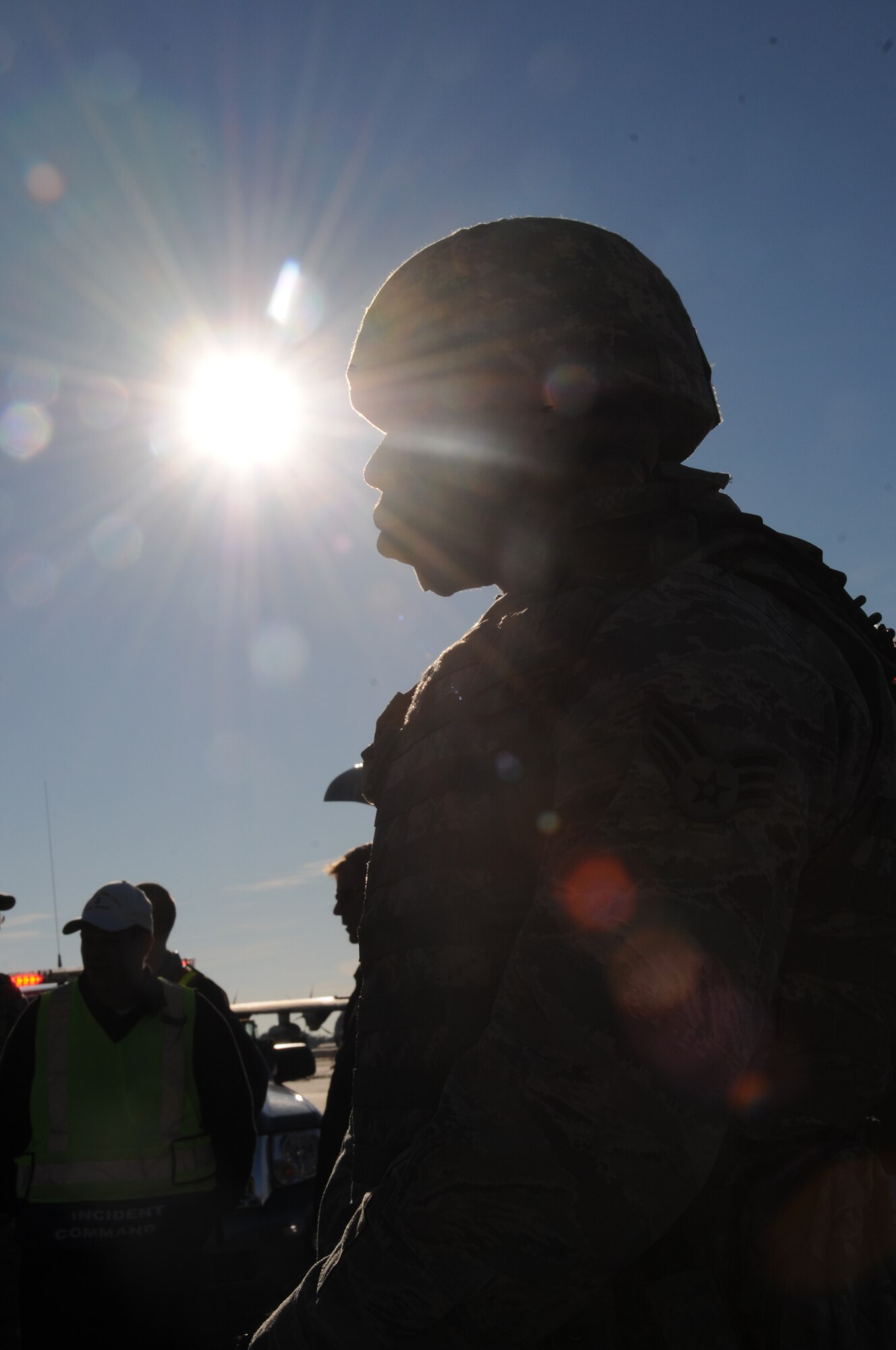 An 81st SFS member stands on the flightline awaiting orders to move in on the hijacked aircraft, a WC-130J from the 403rd Wing.  (U.S. Air Force photo by Kemberly Groue)