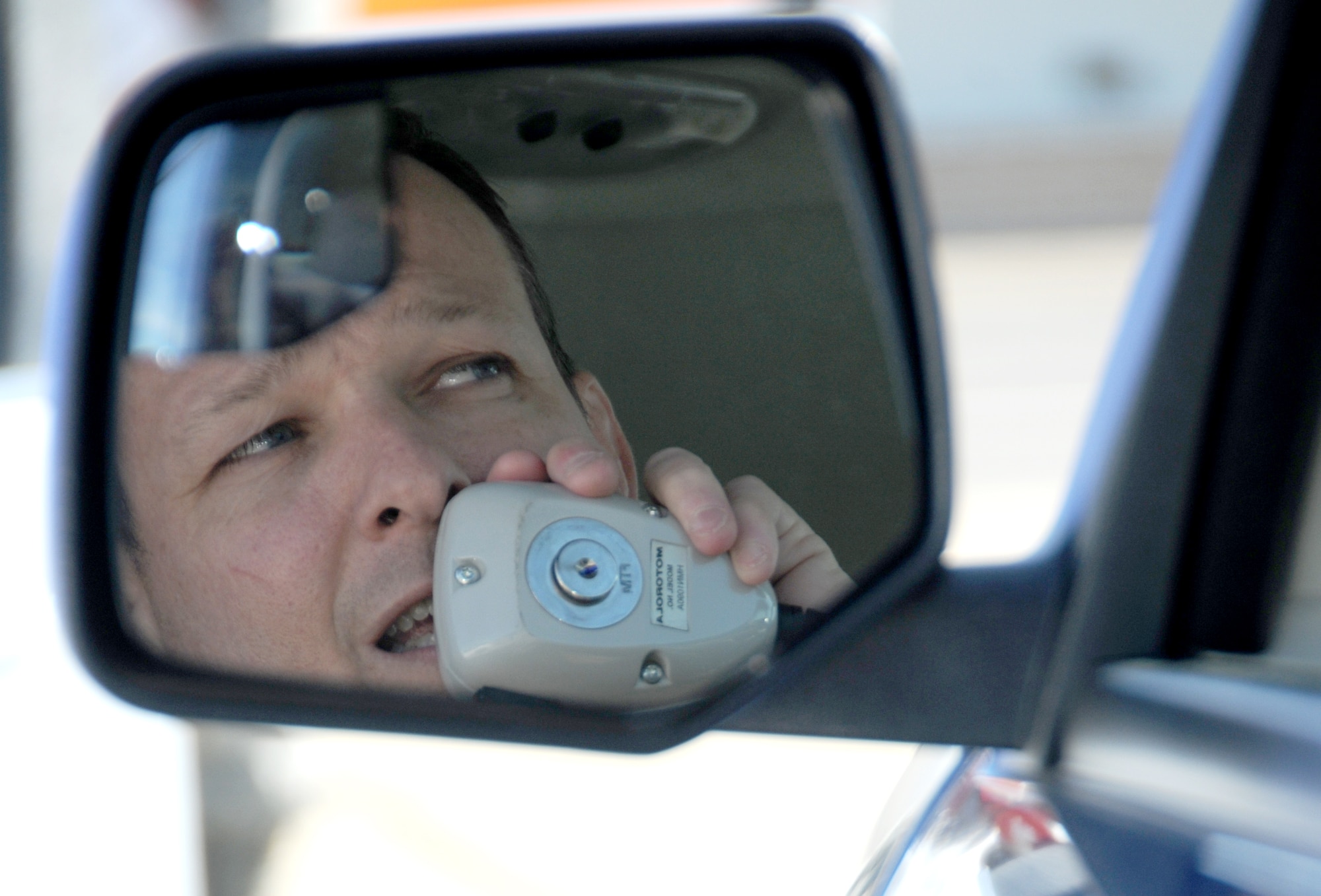 Keesler fire chief James Donnett keeps in touch with other responders by radio during a hijacking exercise Dec. 9.  (U.S. Air Force photo by Kemberly Groue)