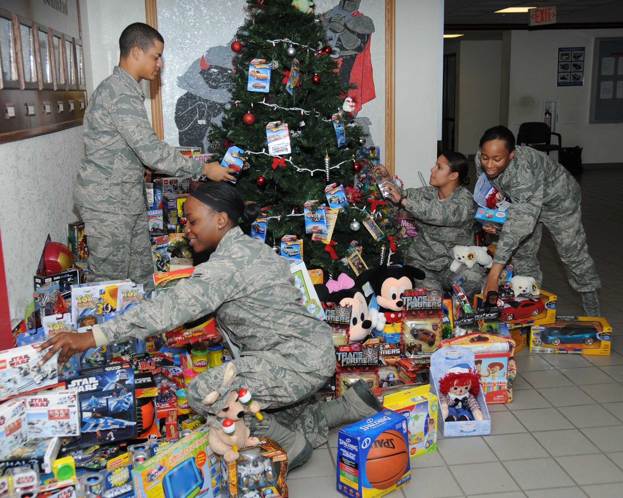 From left, Airman Basic Xavier Kinsey, Airman 1st Class Ashley Sydnor, Airman Basic Mirelys Rivera andAirman 1st Class Dominique Favers, 336thTraining Squadron students, sort gifts collected by their squadron for Toys for Tots. As of Monday, 527 toys have been collected.  (U.S. Air Force photo by Kemberly Groue)