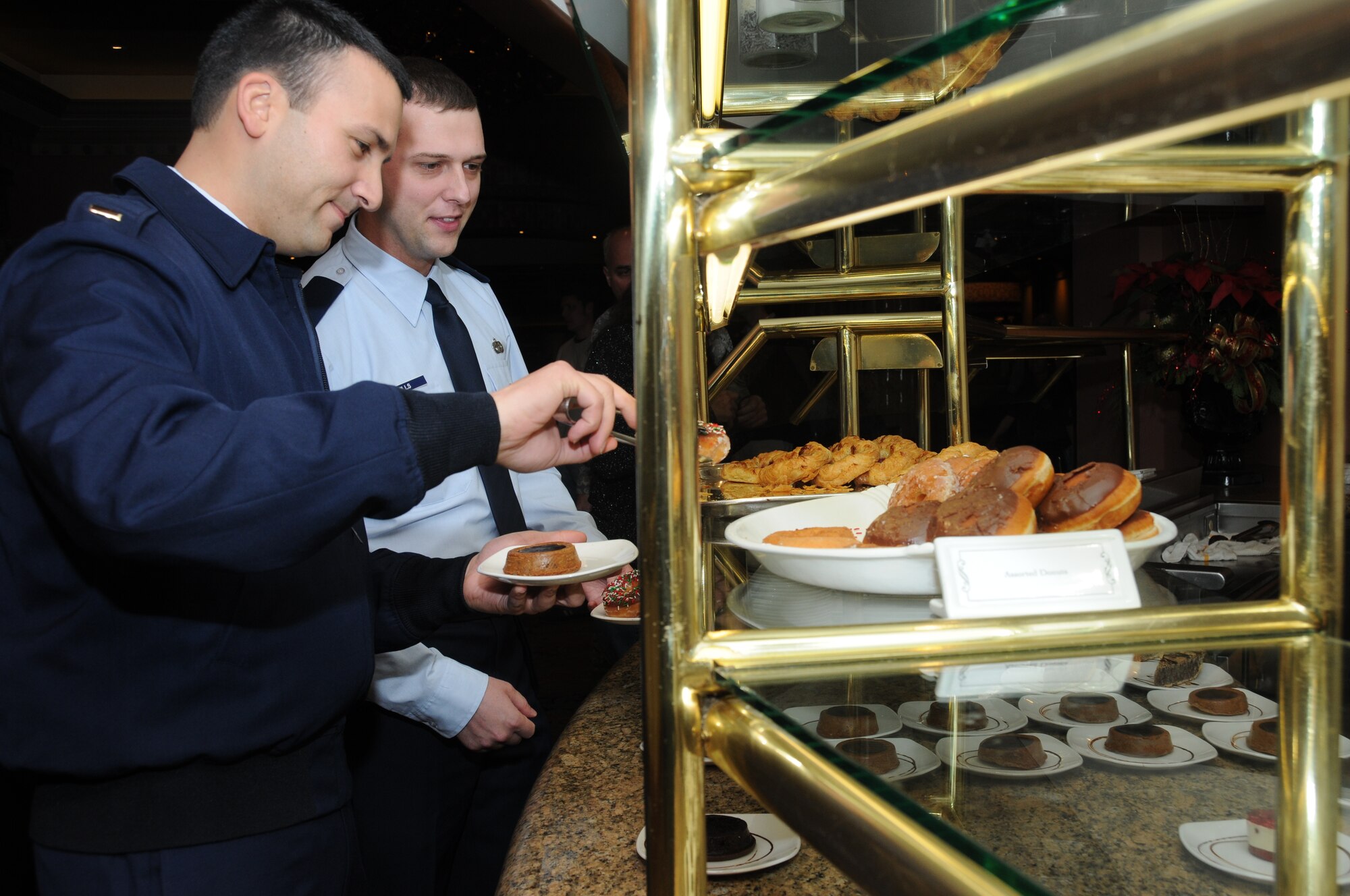 Lieutenants Saberin, left, and Mills get right back on the horse and chow down at a
lunch buffet Monday at a Biloxi casino.  (U.S. Air Force photo by Kemberly Groue)