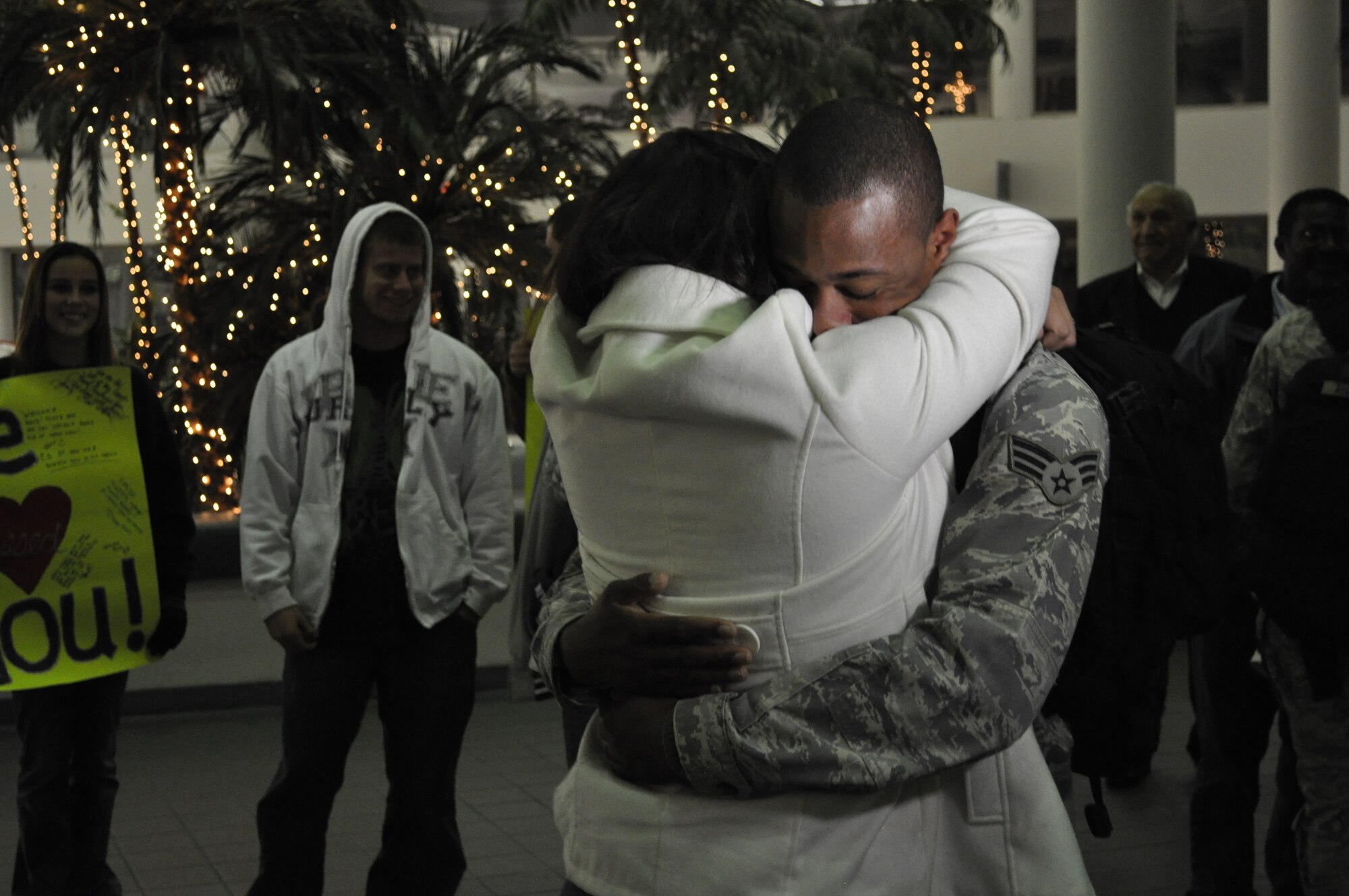 Some gifts, like a hug from your spouse who you haven't seen in half a year,
are priceless.  Special gifts like that were commonplace Tuesday night at
the Melbourne International Airport as nine 45th Space Wing Security Forces
Airmen returned from a 6-month deployment to Southwest Asia.  Here, Senior
Airman Tyrell Freeman embraces his wife, Samantha, as he and his fellow
Airmen arrived home.   "It's good to have them home," said Maj. John
Newton, 45th SFS commander. "It's especially good to have them home for the
holidays."
