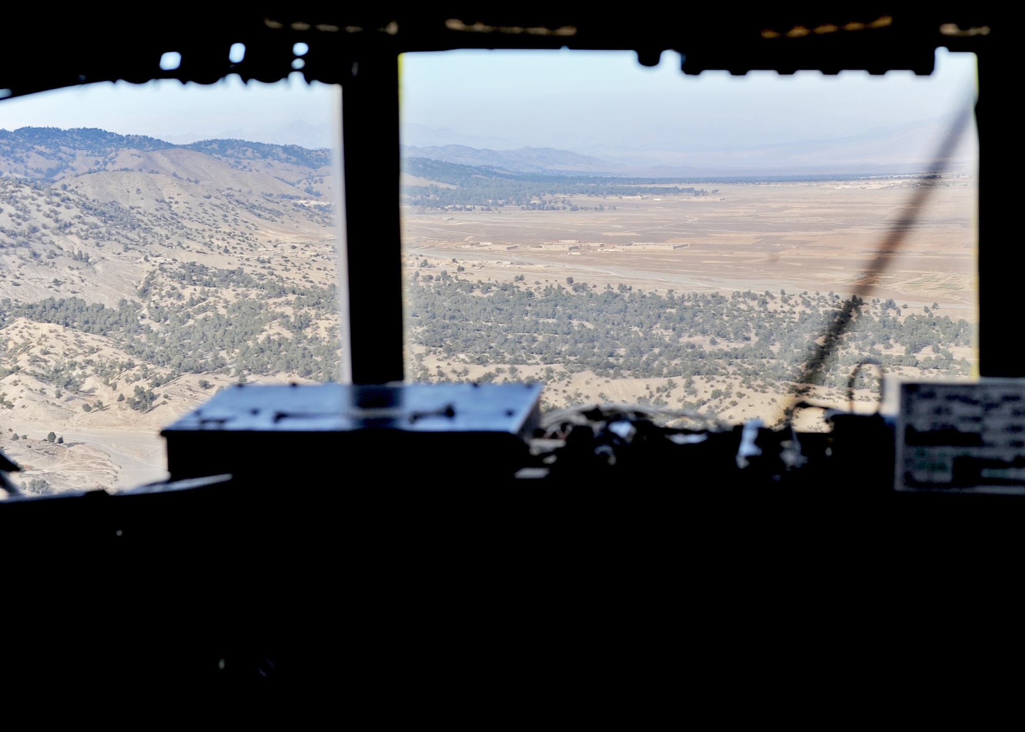 An aerial view of Afghanistan can be seen from the cockpit of a C-130 Hercules assigned to the 386th Air Expeditionary Wing during the wing's first airdrop mission in Afghanistan. (U.S. Air Force photo/Lt. Col. Ken Gjone)