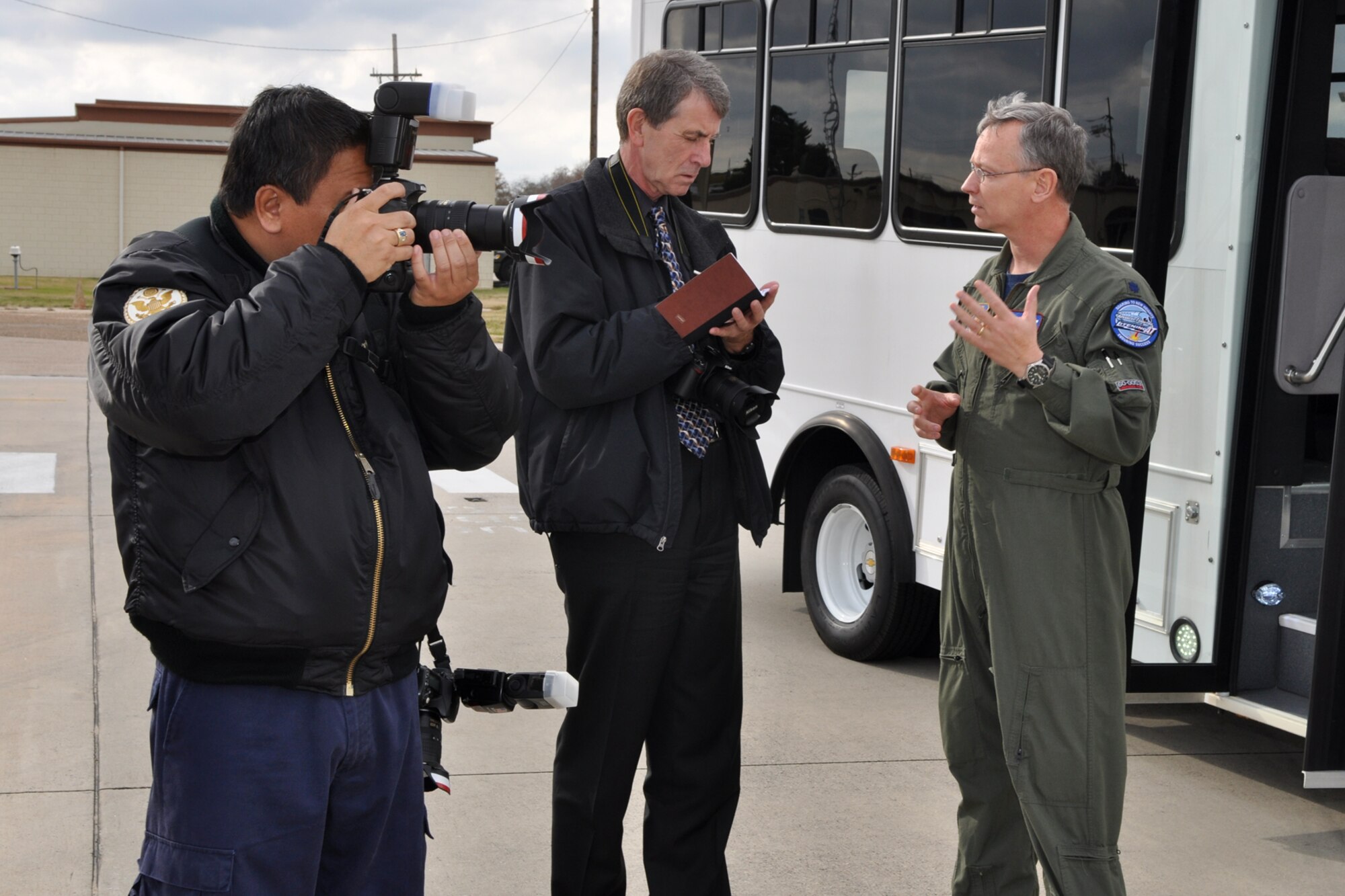 Lt. Col. Joseph “Doc” Jones, commander, 93rd Bomb Squadron, explains the flightline entry process to Phil Rose, managing editor, Professional Pilot magazine at Barksdale Air Force Base, La., Dec. 10, 2010. Mr. Rose and Jack Sykes art director, Professional Pilot magazine, were at Barksdale gathering information and taking photos for a story about the professional pilots of the 917th Wing for an upcoming issue of the Professional Pilot magazine to be published in early 2011. (U.S. Air Force photo/Tech. Sgt. Jeff Walston) 
