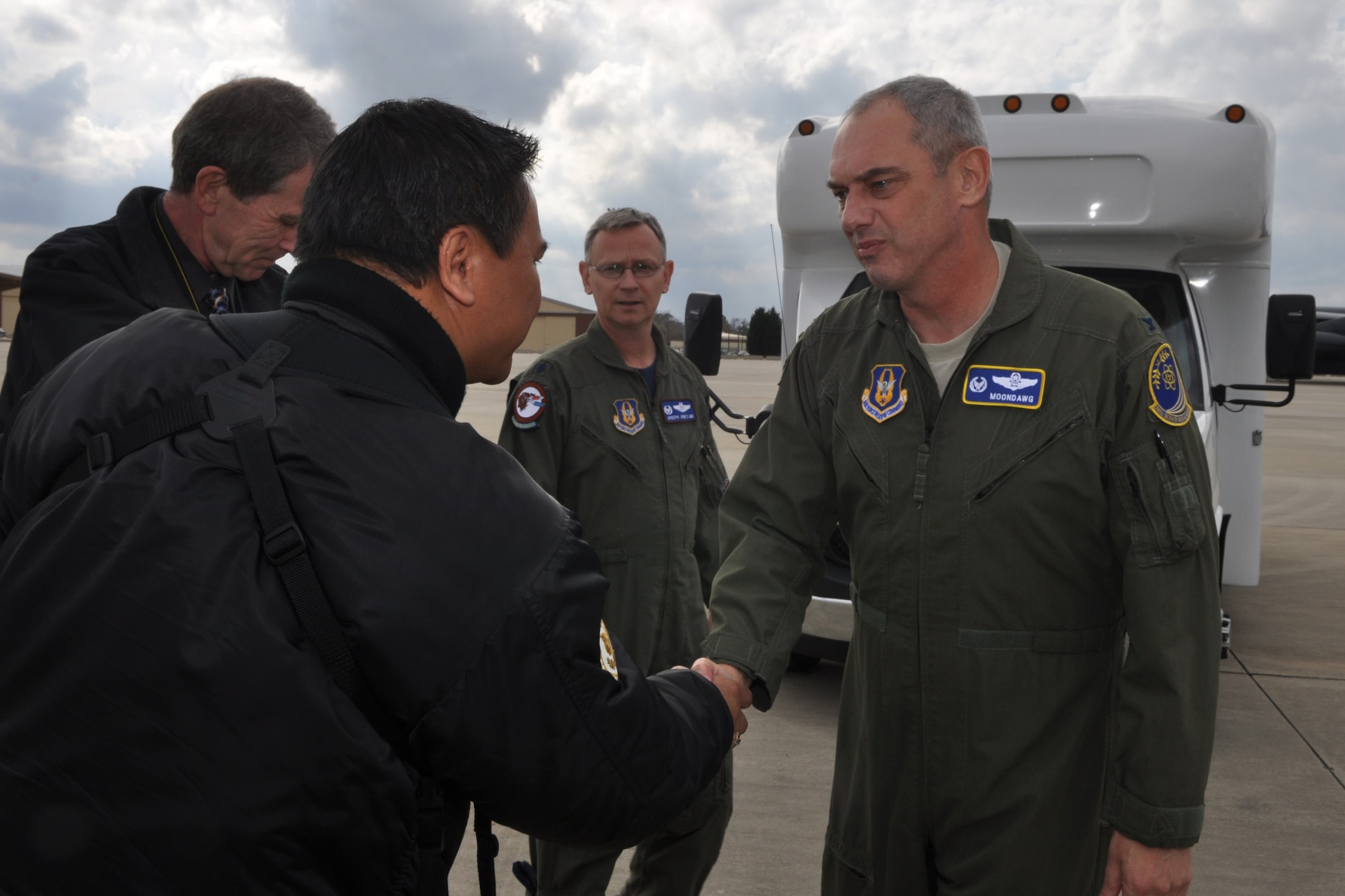 Col. John J. Mooney III, commander, 917th Wing, meets Jack Sykes, art director, Professional Pilot magazine on the ramp at Barksdale Air Force Base, La., Dec. 10, 2010. Mr. Sykes was at Barksdale gathering information and taking photos for a story about the professional pilots of the 917th Wing for an upcoming issue of the Professional Pilot magazine to be published in early 2011. (U.S. Air Force photo/Tech. Sgt. Jeff Walston) 

