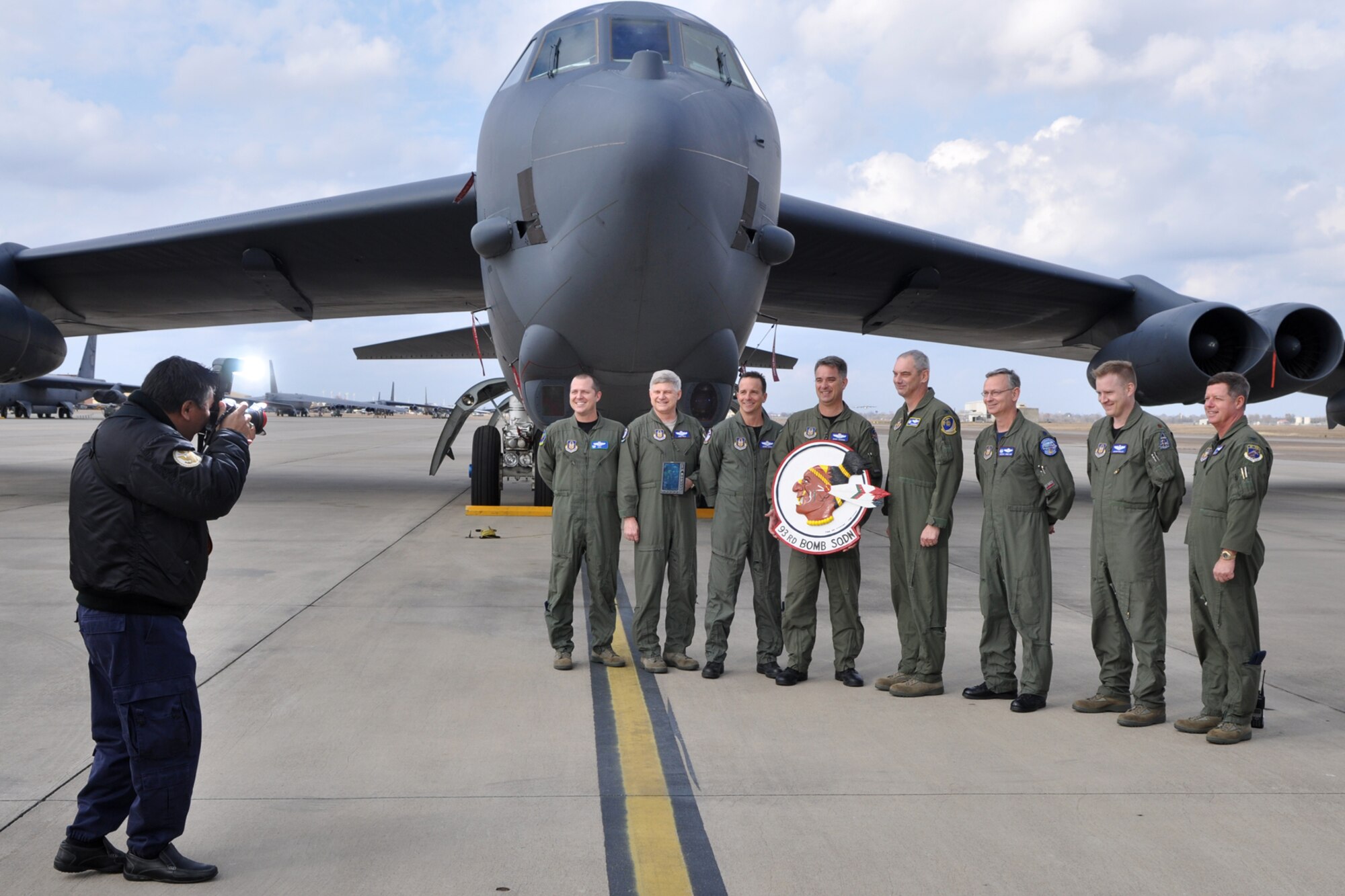 Jack Sykes, art director, Professional Pilot magazine, photographs Lt. Col. James Travis, commander, 47th Fighter Squadron, Lt. Col. Richard Holt, instructor electronic warfare officer, 93rd Bomb Squadron, Lt. Col. Denis Heinz, radar navigator, 93rd BS, Lt. Col. Dave Leedom, director of operations, 93rd BS, Col. John J. Mooney III, commander, 917th Wing, Lt. Col. Joseph Jones, commander, 93rd BS, Maj. Bryan Bailey, B-52 pilot, 93rd BS, and Col. Keith Schultz, commander, 917th Operations Group, on the ramp at Barksdale Air Force Base, La., Dec. 10, 2010. Mr. Sykes was at Barksdale gathering information and taking photos for a story about the professional pilots of the 917th Wing for an upcoming issue of the Professional Pilot magazine to be published in early 2011. (U.S. Air Force photo/Tech. Sgt. Jeff Walston) 
