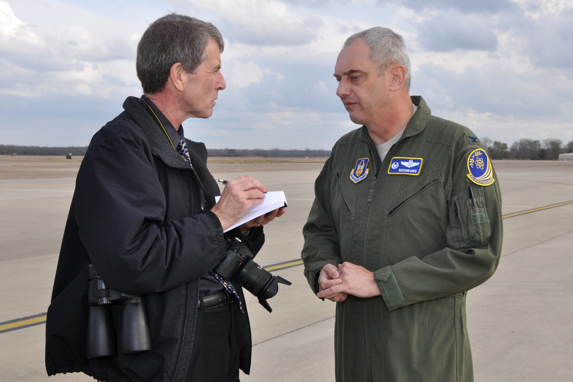 Col. John J. Mooney III, commander, 917th Wing, is interviewed by Phil Rose, managing editor, Professional Pilot magazine, while on the ramp at Barksdale Air Force Base, La., Dec. 10, 2010. Mr. Rose was at Barksdale gathering information for a story about the professional pilots of the 917th Wing for an issue of the Professional Pilot magazine to be published in early 2011. (U.S. Air Force photo/Tech. Sgt. Jeff Walston) 