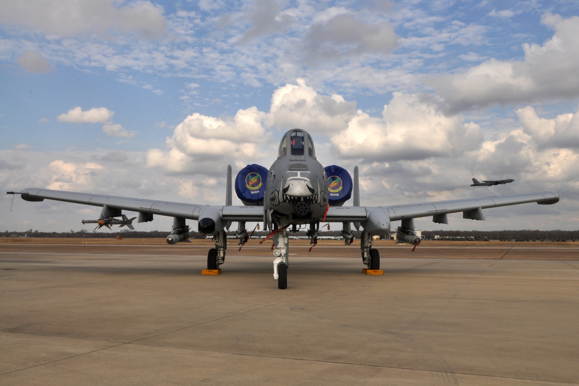 An A-10 Thunderbolt II from the 47th Fighter Squadron sits on the ramp as a B-52 Stratofortress from the 917th Wing lifts off the runway behind it at Barksdale Air Force Base, La., Dec. 10, 2010. (U.S. Air Force photo/Tech. Sgt. Jeff Walston) 