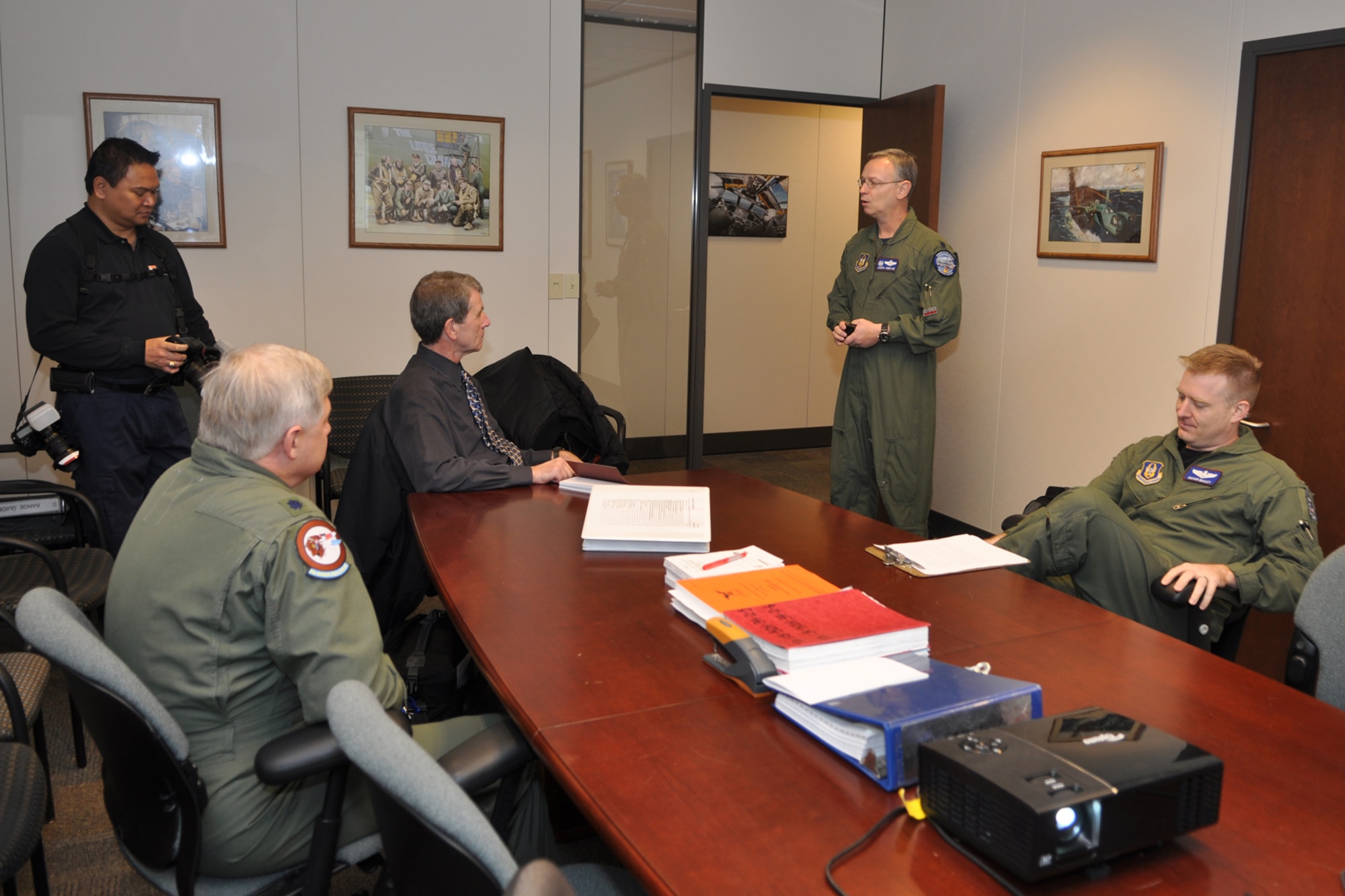 Jack Sykes, art director, Professional Pilot magazine, Lt. Col. Richard Holt, instructor electronic warfare officer, 93rd Bomb Squadron, Phil Rose, managing editor, Professional Pilot magazine, and Maj. Bryan Bailey, B-52 pilot, 93rd BS, listen as Lt. Col. Joseph Jones, commander, 93rd BS, describes the day’s itinerary at Barksdale Air Force Base, La., Dec. 10, 2010. Mr. Rose and Sykes were at Barksdale gathering information and photos for a story about the professional pilots of the 917th Wing for an issue of the Professional Pilot magazine to be published in early 2011. (U.S. Air Force photo/Tech. Sgt. Jeff Walston) 