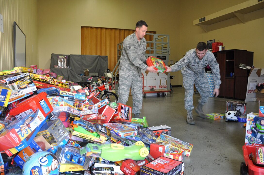Staff Sgts. Vincent Edwards (left) and Jared Longren of the 373rd Training Squadron's Detachment 14 at Travis Air Force Base, Calif., sort toys recently in preparation for deliveries during the holidays. The detachment's efforts are part of the Marine Corps' Toys for Tots program. Since there isn't a Marine Corps unit at or near Travis, the 373rd TRS's Det. 14 took on the responsibility about 34 years ago to bring holiday cheer to the less fortunate. (Courtesy photo)