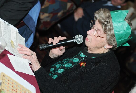 RAF MILDENHALL, England -- Joan Aves reads "The Shepherd Boy" during the 29th Annual Senior Citizens Luncheon here Dec. 16, 2010. This event was organized by the Top Three and sponsored by several base organizations to help maintain partnerships with the local communities. (U.S. Air Force photo/Senior Airman Tabitha M. Lee) 