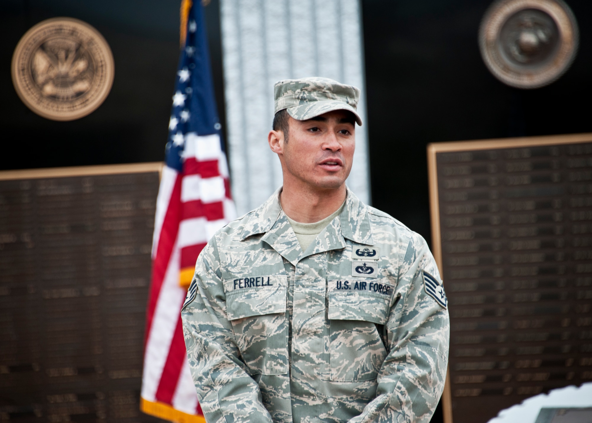 Staff Sgt. Christopher Ferrell, Naval Explosive Ordnance Disposal instructor, addresses audience of Air Force EOD technicians during a ceremony in his and Staff Sgt. David Flowers’ honor Dec. 15.  The two NCOs were presented with a framed copy of their Air Force “Portraits of Courage” page by Brig. Gen. Darryl Burke, 82nd Training Wing commander.  The fifth edition of “Portraits of Courage” features 18 of the Air Force’s finest Airmen and their story of heroism.  To learn more about their heroic acts, go to http://www.af.mil/shared/media/document/AFD-101213-043.pdf.  (U.S. Air Force photo/Samuel King Jr.)