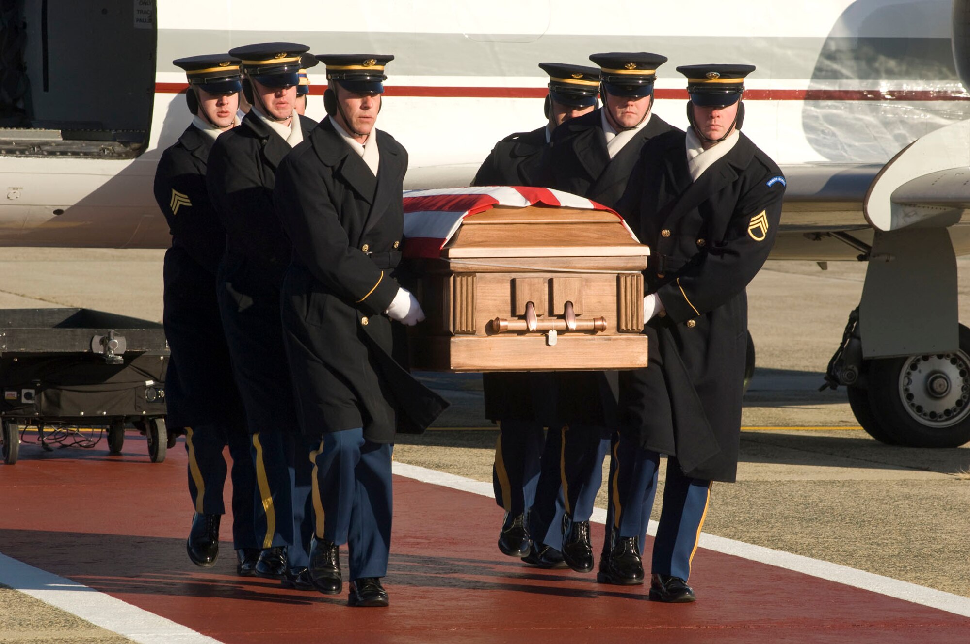 HANSCOM AIR FORCE BASE, Mass. – U.S. Army pallbearers carry the casket containing the remains of Army Lt. Scott Milley of Sudbury, Mass., during a ceremony at the base flightline on Dec. 9. Lieutenant Milley was assigned to the 2nd Battalion, 30th Infantry Regiment, 4th Brigade Combat Team, 10th Mountain Division based in Fort Polk, La. He was killed by small arms fire while in patrol in Afghanistan on Nov. 30. His father is an employee at MIT Lincoln Lab. (U.S. Air Force photo by Mark Wyatt)
