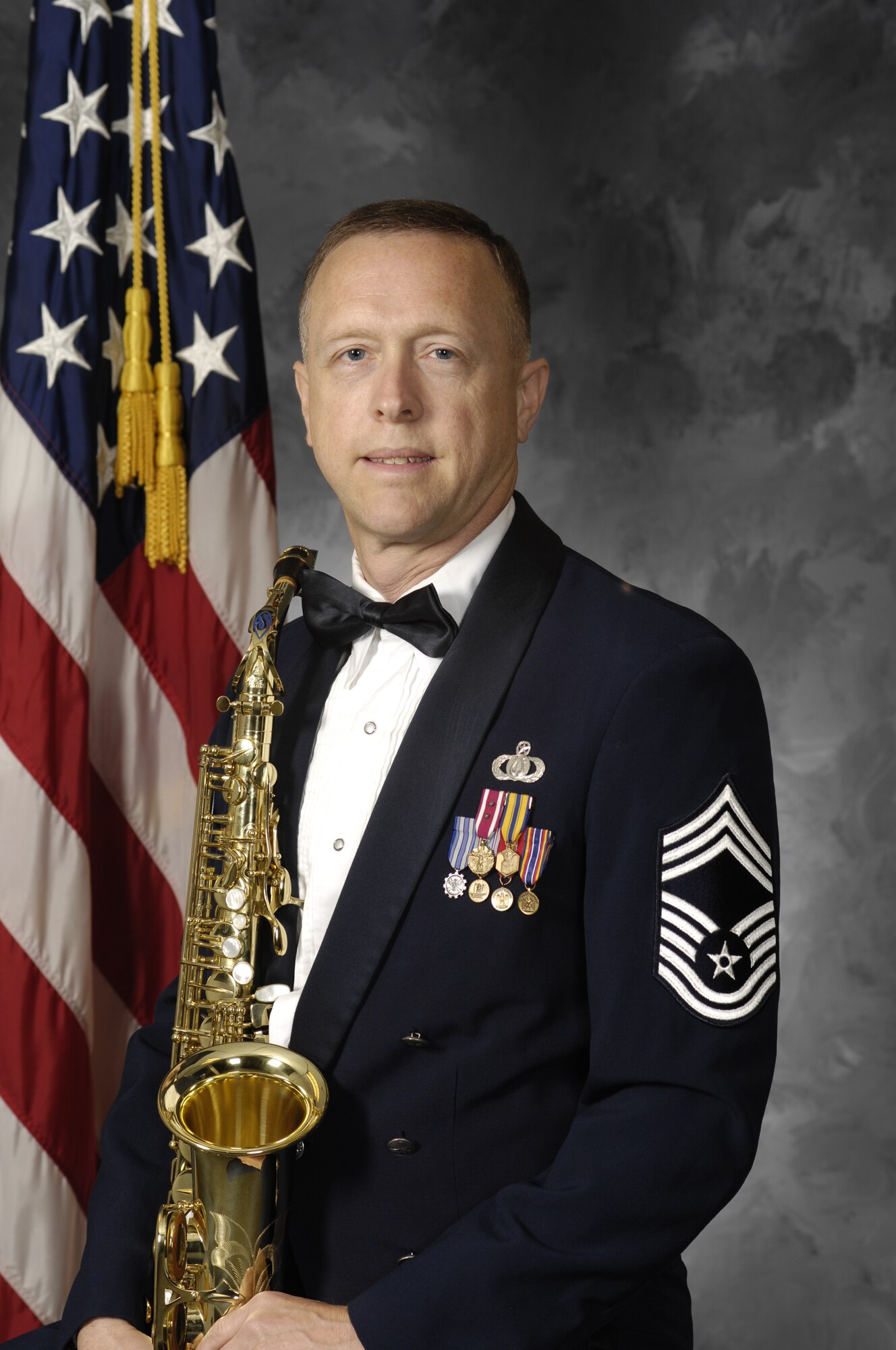 Chief Master Sgt. William Marr, the noncommissioned officer-in-charge of the Concert Band, was the featured instrumental soloist at the VMEA convention, performing Gunther Schuller's "A Tribute to Rudy". Chief Marr hails from Alexandria, Va., and grew up as a student in Virginia's Fairfax County Public Schools. More than a dozen other members of the Concert Band and Singing Sergeants grew up attending public schools in "The Old Dominion." (Official US Air Force Photo)