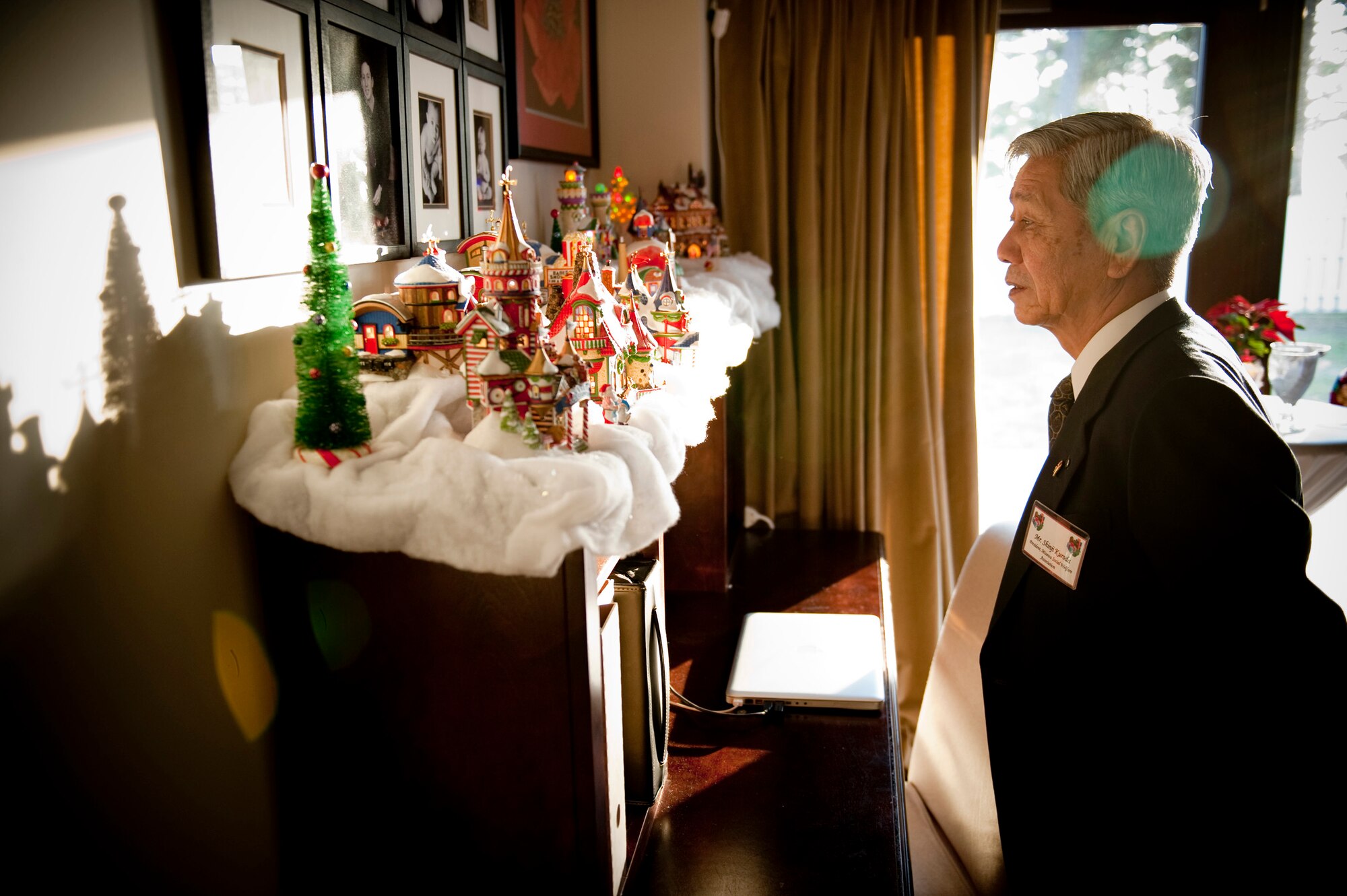 Shinji Kuroda, Misawa Social Welfare Association president, admires decorations at the Rothsteins' home, Misawa Air Base, Japan, during a holiday social event Dec. 12, 2010. Local Japanese dignitaries were given a taste of American hospitality and holiday cheer to bolster the relationship with American and Japanese communities. (U.S. Air Force photo by Staff Sgt. Samuel Morse/Released)