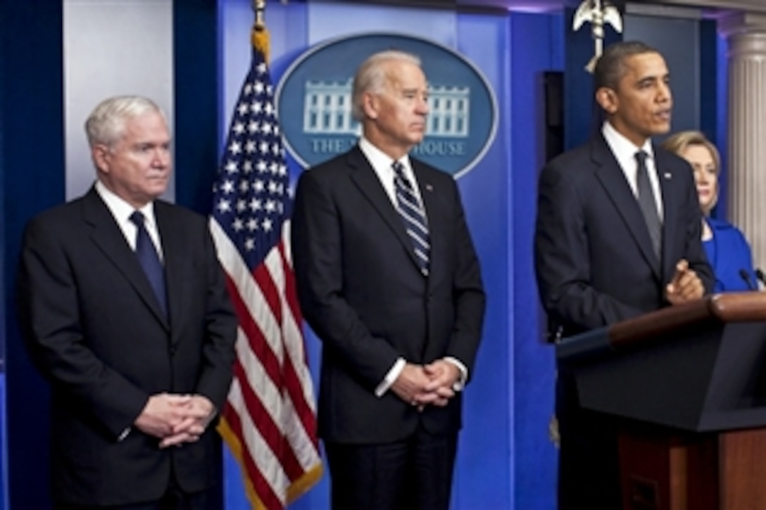 Defense Secretary Robert M. Gates, left, and Vice President Joe Biden listen as President Barack Obama speaks on the Afghanistan-Pakistan Annual Review, describing the situation as "a very difficult endeavor" but saying there has been "significant progress," at the White House, Dec. 16, 2010.

