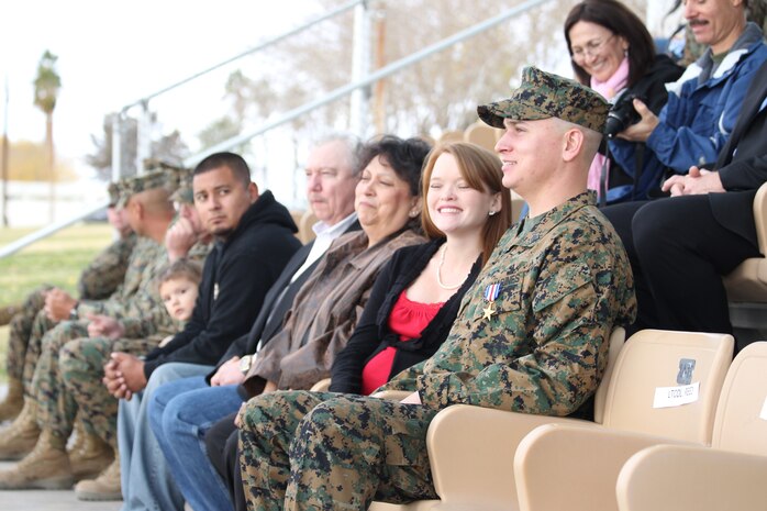 Sergeant William W. Rollins and his wife Alexandra Rollins enjoy the moment after a ceremony in which Rollins was awarded the Silver Star, the Nation's third-highest award in a ceremony at the Combat Center's Lance Cpl. Torrey L. Gray Parade Field Dec. 17, 2010.