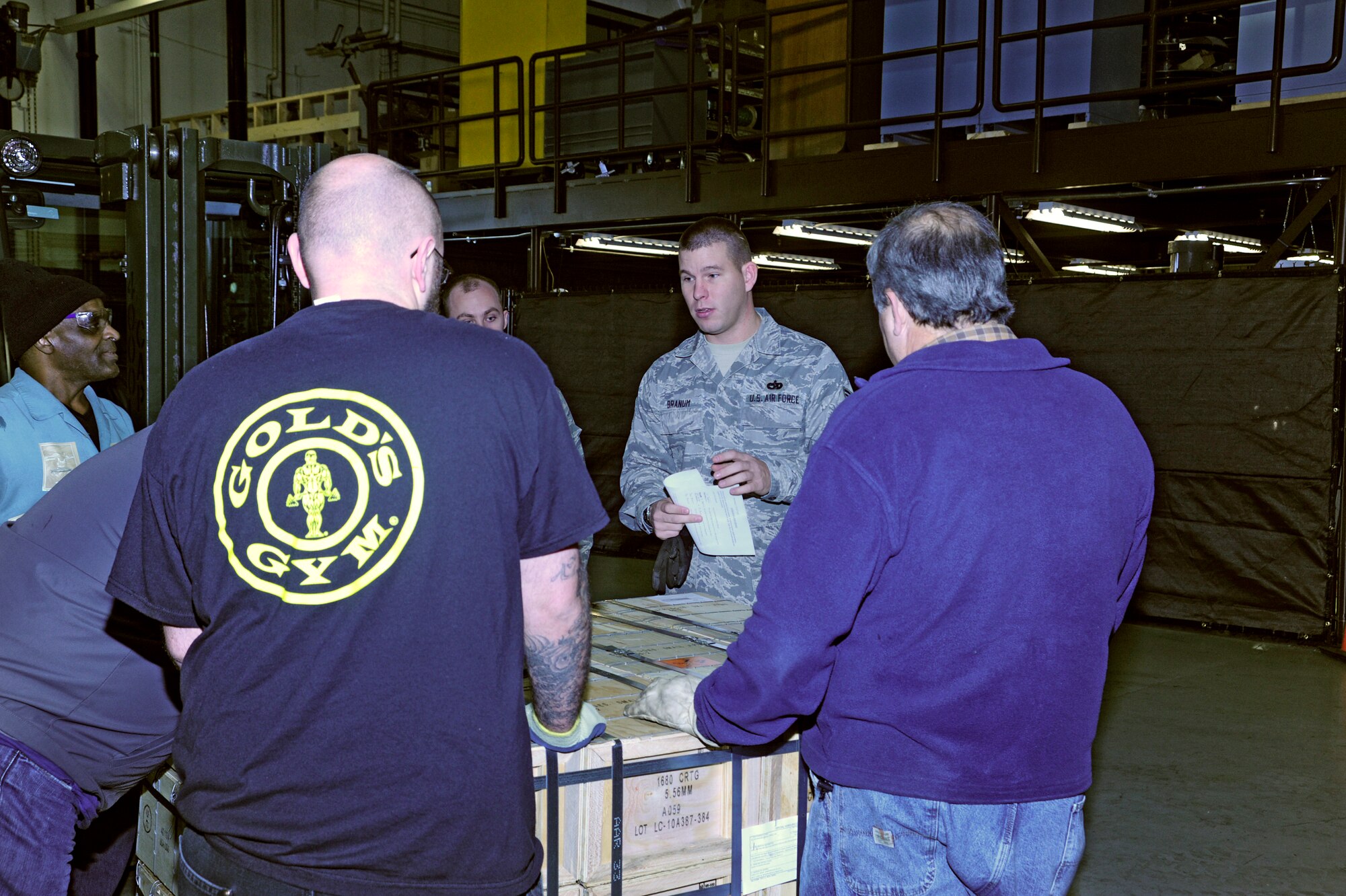 Tech. Sgt. Charles Branum, center, 62nd APS shift supervisor, provides a briefing before moving a large shipment of ammo Dec. 15 at McChord Field, Joint Base Lewis-McChord, Wash. The ammo will be delivered to the Middle East for missions supporting Operation Enduring Freedom. (U.S. Air Force photo/Adamarie Lewis-Page)