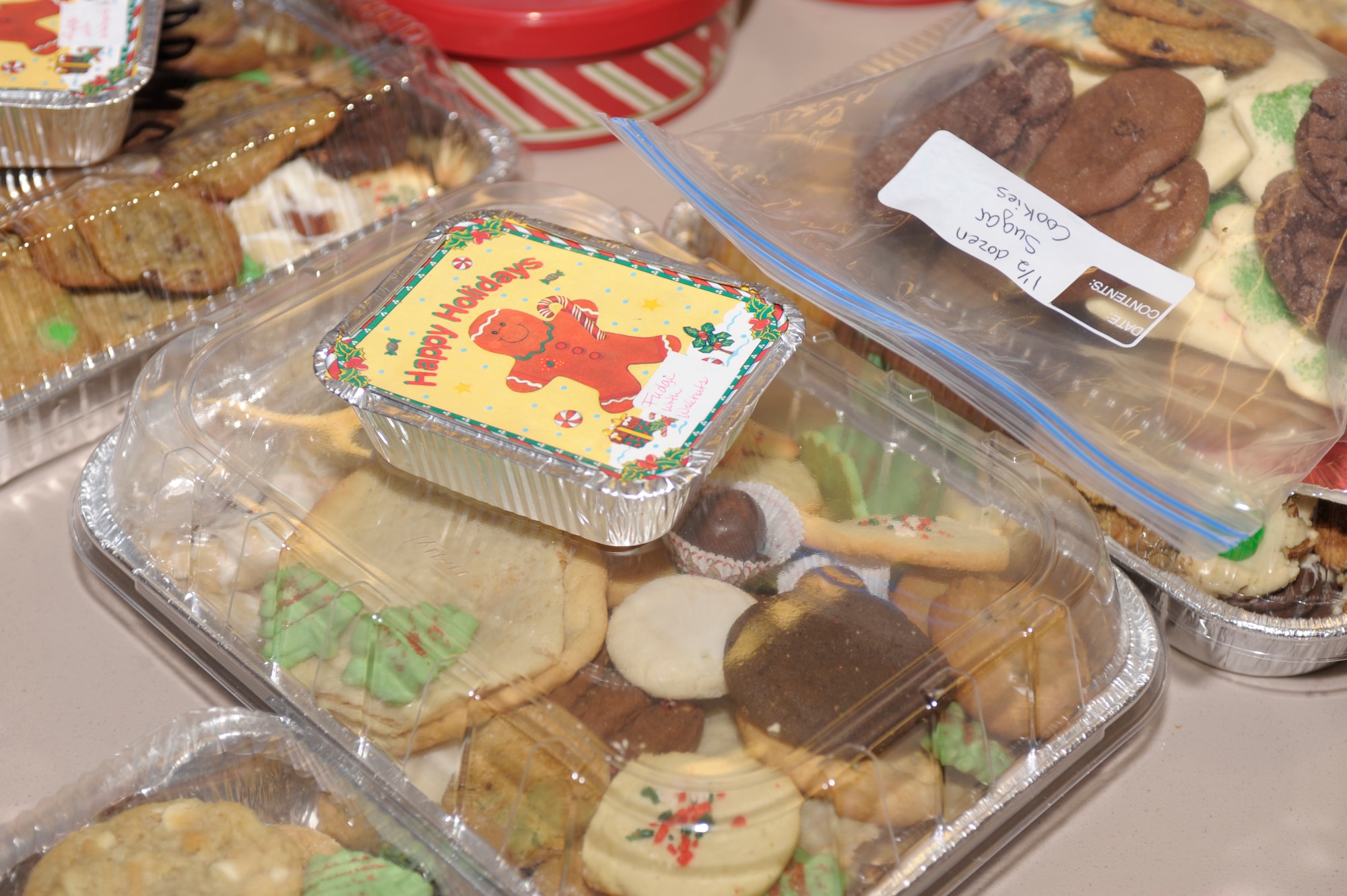 Cookies are piled high at the chapel cookie drive Dec. 16. Over 10,000 cookies were donated to the drive and will be distributed to Airmen who are living in the dorms by their squadron's first sergeant as a part of Operation Cookie Drop. (U.S. Air Force Photo by Airman Ericka Engblom)