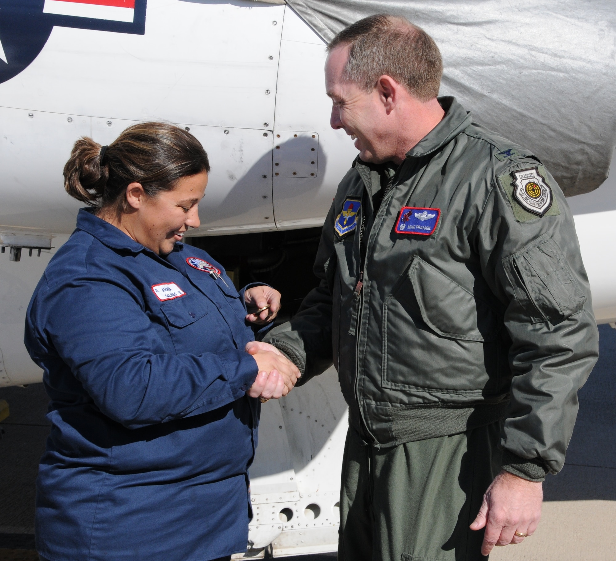LAUGHLIN AIR FORCE BASE, Texas – Joanna Salinas, 47th Maintenance Directorate, is presented the XLer of the Week award by Col. Michael Frankel, 47th Flying Training Wing commander on Laughlin’s flight line Dec. 15. The XLer is a weekly award chosen by wing leadership and given to individuals who consistently make outstanding contributions to Laughlin and their unit. (U.S. Air Force photo by Airman 1st Class Blake Mize)