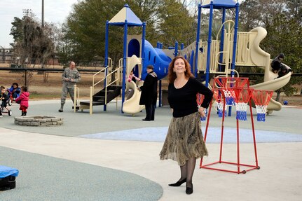 Mrs. Carmen Mikolajcik looks around the playground of the new General Thomas R. Mikolajcik Child Development Center during the rededication ceremony at Joint Base Charleston on Dec. 16, 2010. The new center  is able to serve more than 300 children and replaced a 38-year-old facility that could handle about half as many children. Mrs. Mikolajcik is the wife of former General Mikolajcik. (U.S. Air Force photo/Staff Sgt. Marie Brown)