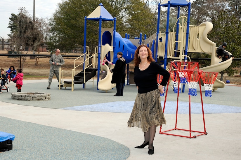 Mrs. Carmen Mikolajcik looks around the playground of the new General Thomas R. Mikolajcik Child Development Center during the rededication ceremony at Joint Base Charleston on Dec. 16, 2010. The new center  is able to serve more than 300 children and replaced a 38-year-old facility that could handle about half as many children. Mrs. Mikolajcik is the wife of former General Mikolajcik. (U.S. Air Force photo/Staff Sgt. Marie Brown)