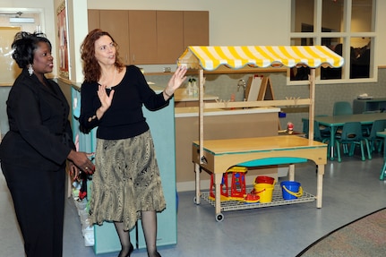 Mrs. Delores Phelps, left, gives Mrs. Carmen Mikolajcik, right, a tour of the new General Thomas R. Mikolajcik Child Development Center during the rededication ceremony at Joint Base Charleston on Dec. 16, 2010. The new center is able to serve more than 300 children and replaced a 38-year-old facility that could handle about half as many children. Mrs. Phelps is the CDC director and Mrs. Mikolajcik is the wife of former General Mikolajcik. (U.S. Air Force photo/Staff Sgt. Marie Brown)