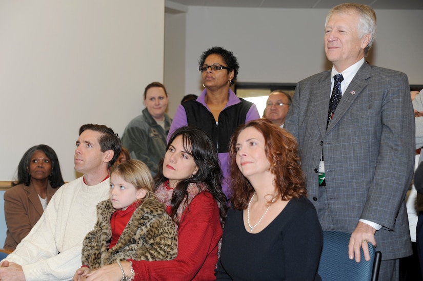 The Mikolajcik family and special guests listen to remarks during the rededication ceremony of the new General Thomas R. Mikolajcik Child Development Center at Joint Base Charleston on Dec. 16, 2010. The new center is named for Brig. Gen. Thomas Mikolajcik who was the former commander of the 437th Airlift Wing. (U.S. Air Force photo/Staff Sgt. Marie Brown)