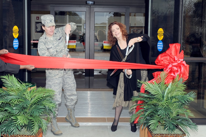 U.S. Air Force Col. Martha Meeker and Mrs. Carmen Mikolajcik cut the ribbon to the new General Thomas R. Mikolajcik Child Development Center during the rededication ceremony at Joint Base Charleston on Dec. 16, 2010. The new center is named for Brig. Gen. Thomas Mikolajcik who was the former commander of the 437th Airlift Wing. Colonel Meeker is the 628th Air Base Wing commander and Mrs. Mikolajcik is the wife of former General Mikolajcik. (U.S. Air Force photo/Staff Sgt. Marie Brown)