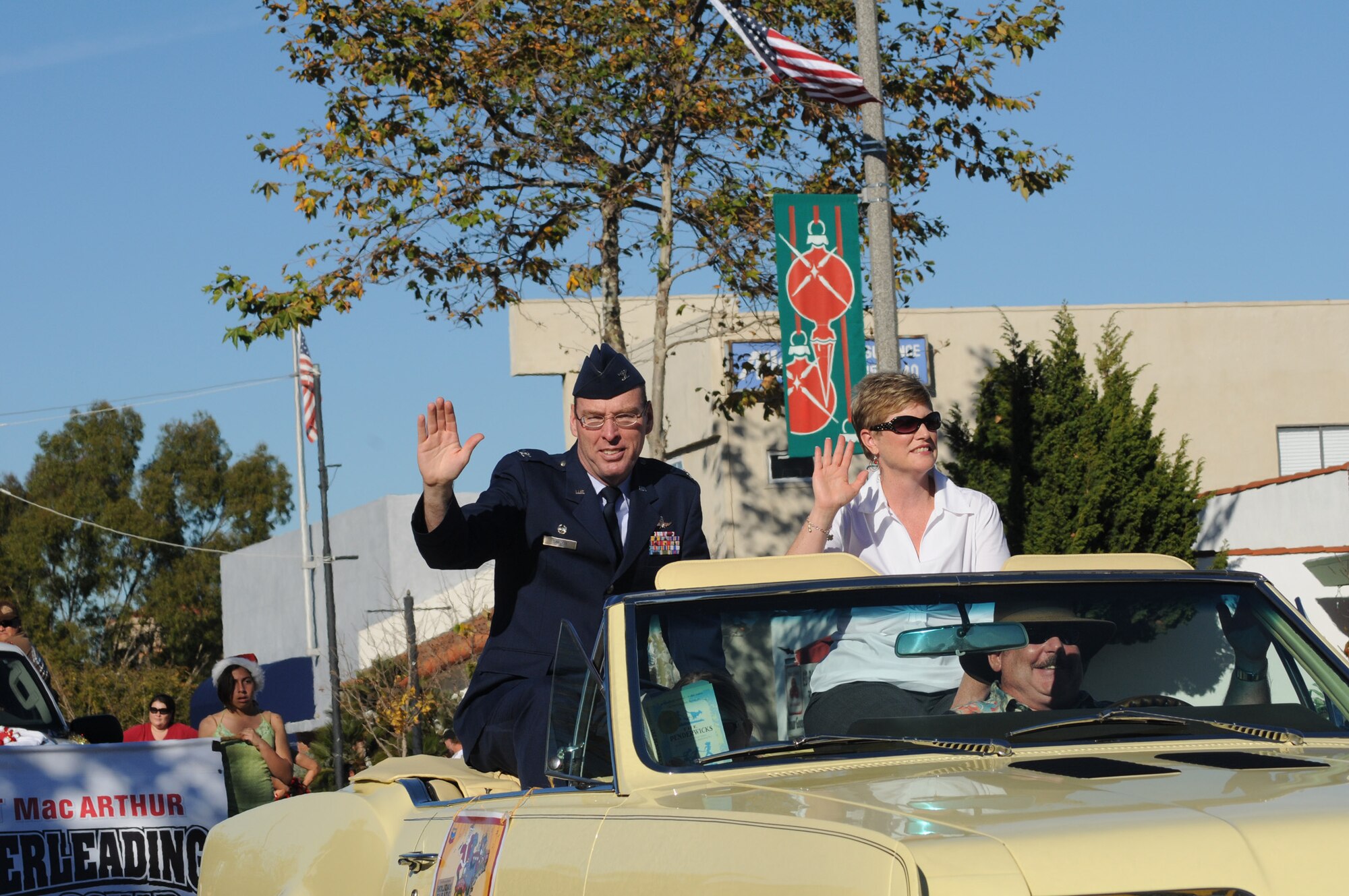 61st Air Base Group Commander, Col. Frank Simcox and his wife Susan wave to the crowd at the City of El Segundo’s annual holiday parade, Dec. 12. (Photo by Joe Juarez)