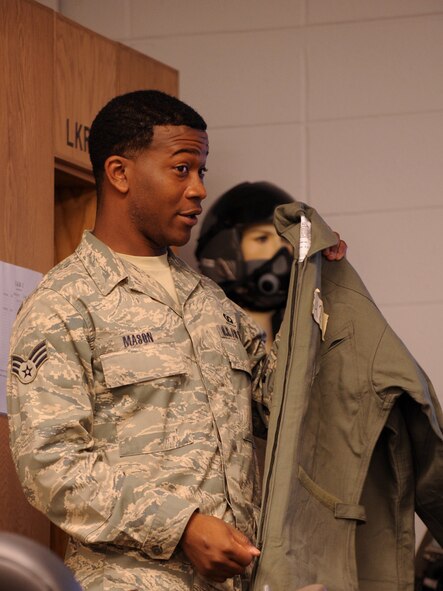 MOODY AIR FORCE BASE, Ga. -- Senior Airman Willie Mason, 23rd Operations Support Squadron aircrew flight equipment technician, teaches pilots how to properly wear their chemical warfare gear Dec. 17. Pilots must attend this class annually in addition to completing a decontamination course. (U.S. Air Force photo/Airman 1st Class Douglas Ellis)(RELEASED)
