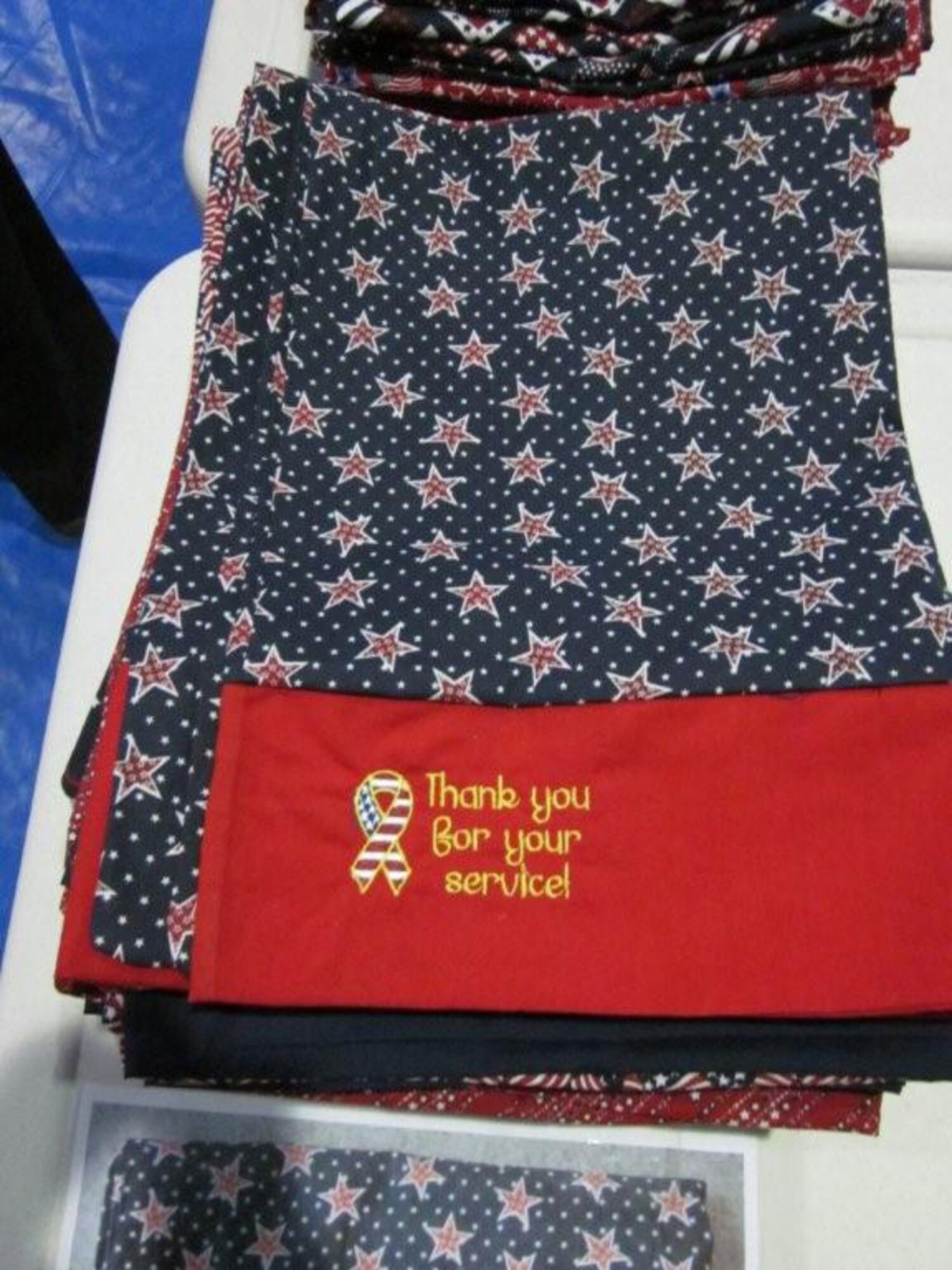 An embroidered handmade pillow case is the finishing touch for care packages designed to thank Wounded Warriors. Staff members in the Office of Air Force Reserve, Pentagon, presented the care packages to Wounded Warriors in the Walter Reed Hospital on Dec. 3 and Dec. 7, 2010. (U.S. Air Force photo/Col. Bob Thompson)