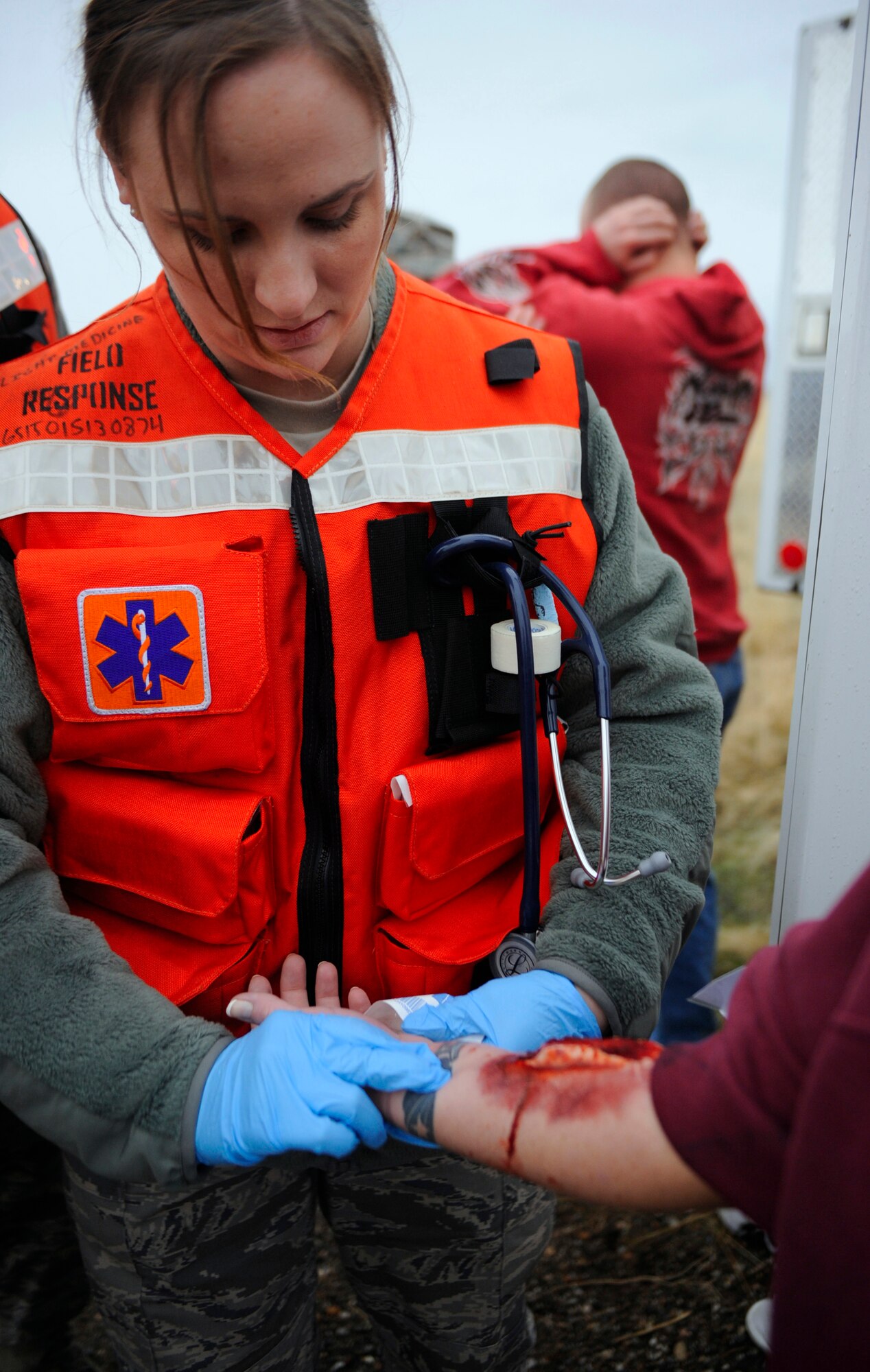 MOUNTAIN HOME AIR FORCE BASE, Idaho -- Staff Sgt. Stacey Bays, 366th Aerospace Medical Squadron emergency response team, checks the pulse of a simulated injured patient during the Emergency Response Exercise Dec. 14. EREs are held to ensure Airmen are prepared to protect people and resources during real-world situations. (U.S. Air Force photo by Senior Airman Renishia Richardson)