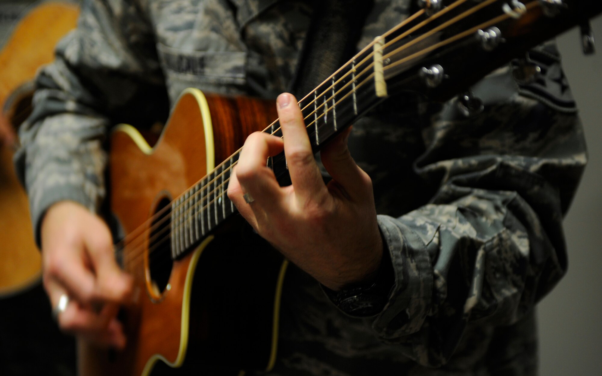 MOUNTAIN HOME AIR FORCE BASE, Idaho -- Staff Sgt. Jason Cale, Air Force Band of the Golden West guitar player, performs for 366th Fighter Wing Staff members Dec. 16. The band traveled from Travis AFB, Calif., to perform Christmas songs throughout the wing. (U.S. Air Force photo by Senior Airman Renishia Richardson)