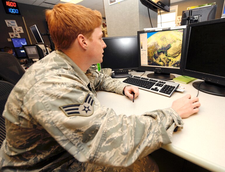 Senior Airman Shawn Carvin, 26th Operational Weather Squadron weather forecaster, analyzes a satellite image on Barksdale Air Force Base, La., Dec. 17. The 26 OWS is responsible for forecasting weather for the entire South East continental United States. (U.S. Air Force photo/Senior Airman Chad Warren) (RELEASED)