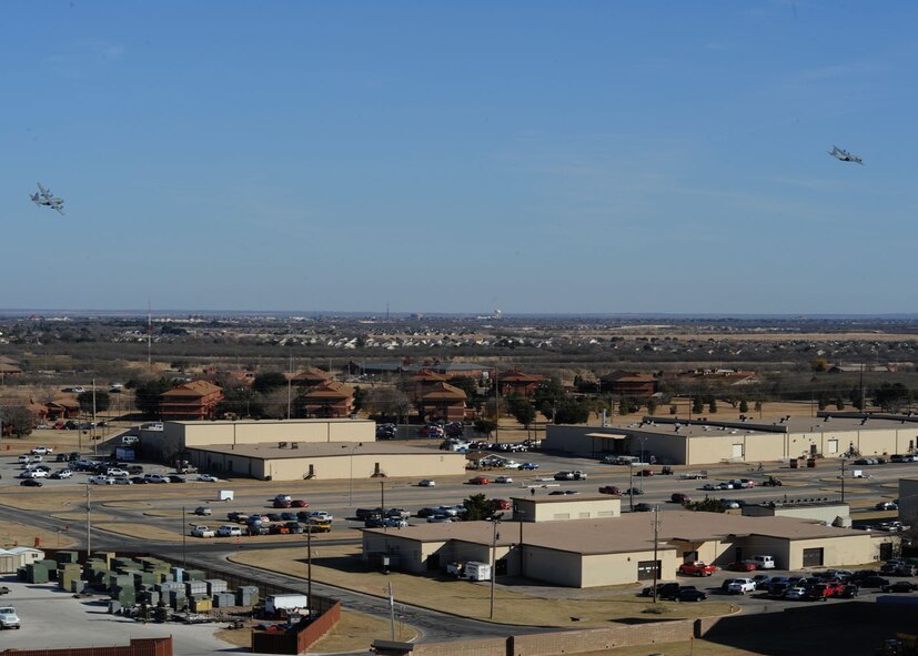 DYESS AIR FORCE BASE, Texas – A C-130 Hercules and a C-130J fly over Dyess Air Force Base Dec. 16 in the first formation flight the two aircraft have flown in formation here. Dyess is replacing the current aging fleet of C-130H models with 28 C-130J models by 2013. The C-130Hs are being sent to different bases or being retired. The aircraft brings many improvements over the C-130H model including avionics and an enhanced cargo handling system. (U.S. Air Force Photo by/ Airman 1st Class Chelsea Cummings)