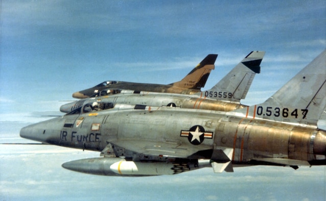 F-100Ds of the 481st Tactical Fighter Squadron over South Vietnam in February 1966. Early F-100s were unpainted when they arrived in Southeast Asia like the foreground aircraft, but all eventually received camouflage paint like the aircraft in the back. (U.S. Air Force photo)