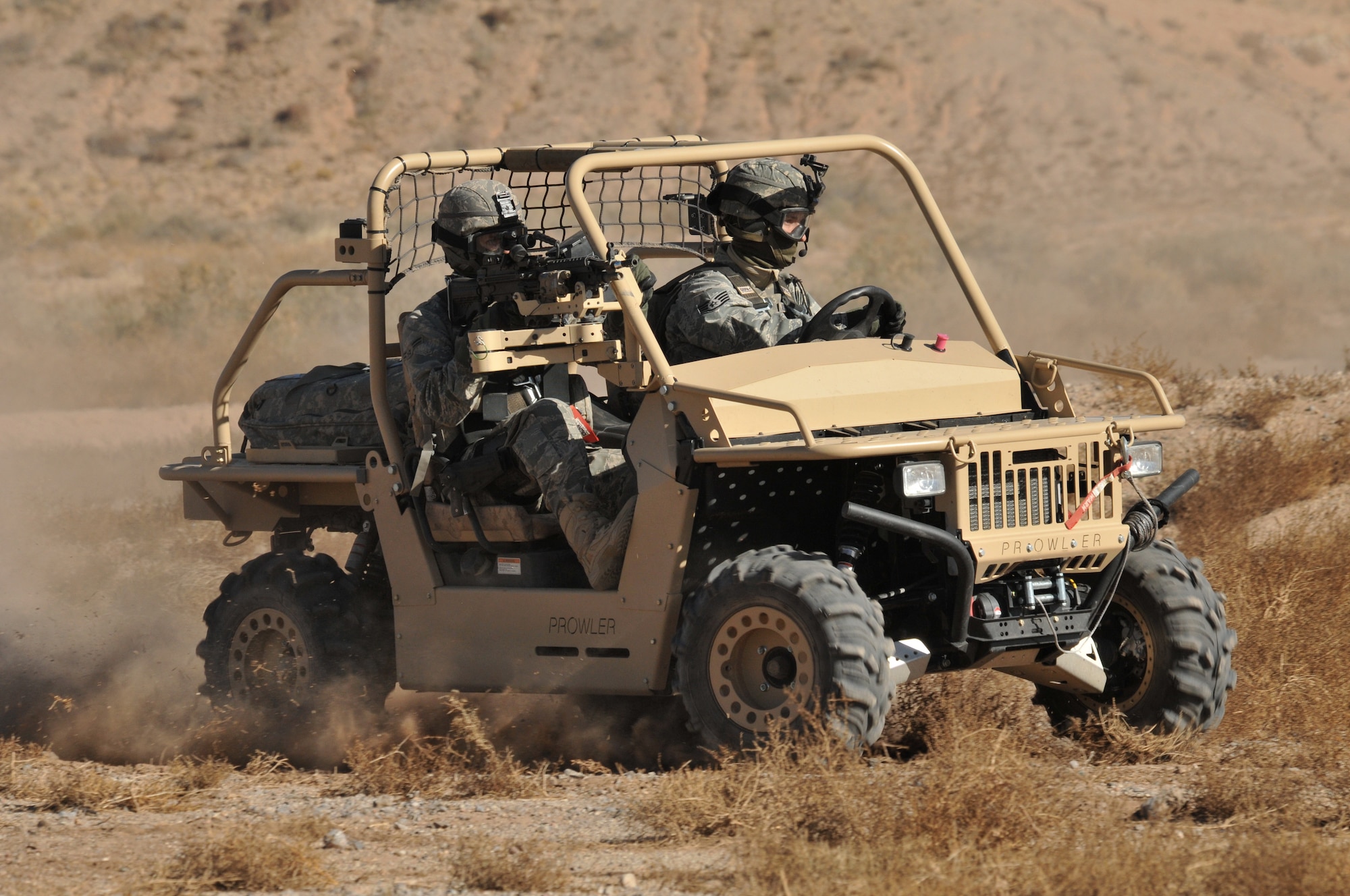 Airmen in all-terrain vehicle participate in a recent exercise at Kirtland Air Force Base. U.S. Air Force Photo by Todd Berenger.