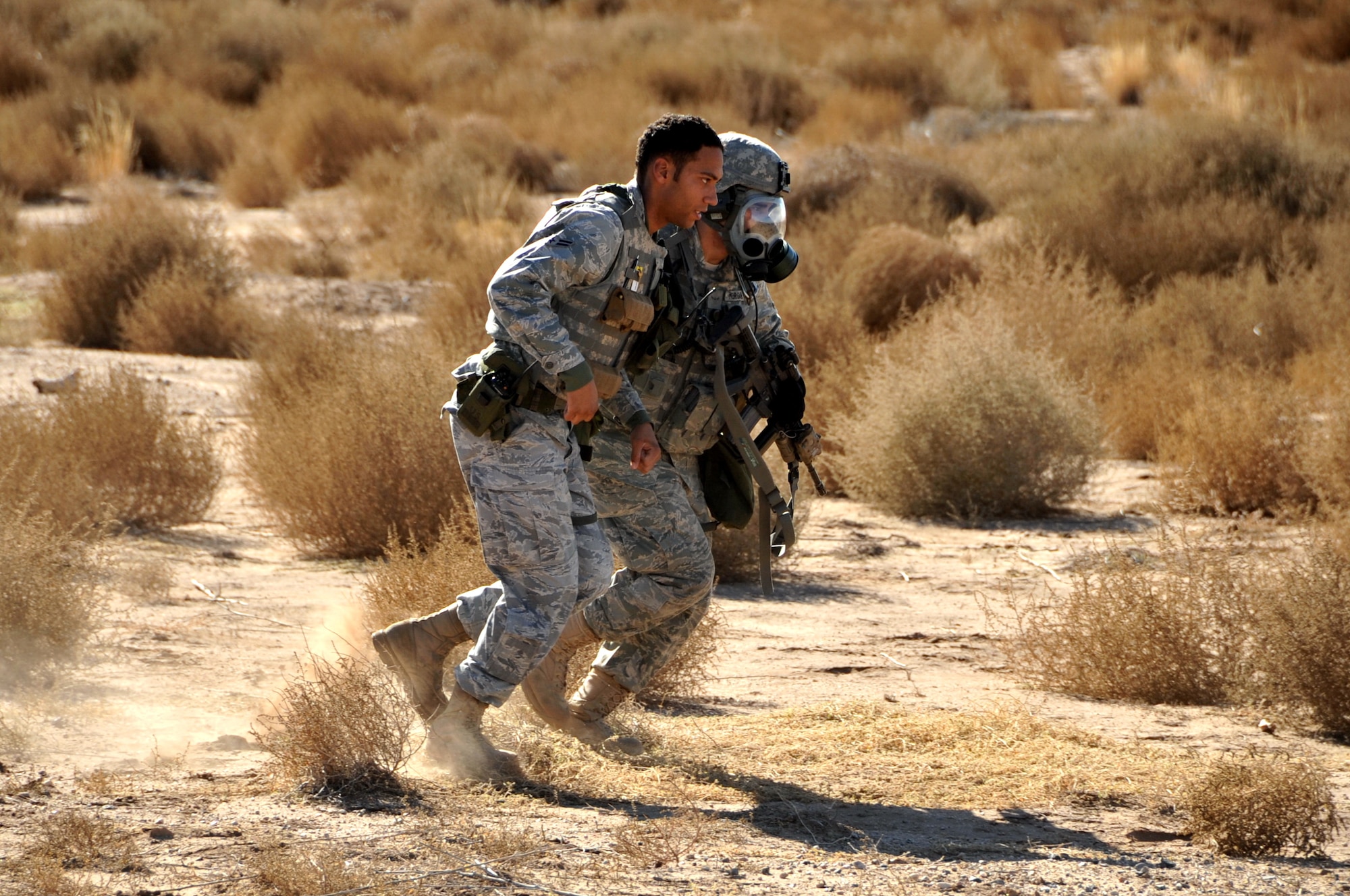 An Airman assists another during a recent exercise at Kirtland Air Force Base. U.S. Air Force Photo by Todd Berenger.