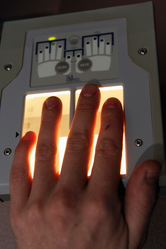 ELLSWORTH AIR FORCE BASE, S.D. -- The new digital fingerprinting system used by the 28th Bomb Wing Information Protection Office electronically captures fingerprints, Dec. 10.  The system allows security professionals to send prints to the Office of Personnel Management in real time. (U.S. Air Force photo/Staff Sgt. Marc I. Lane)