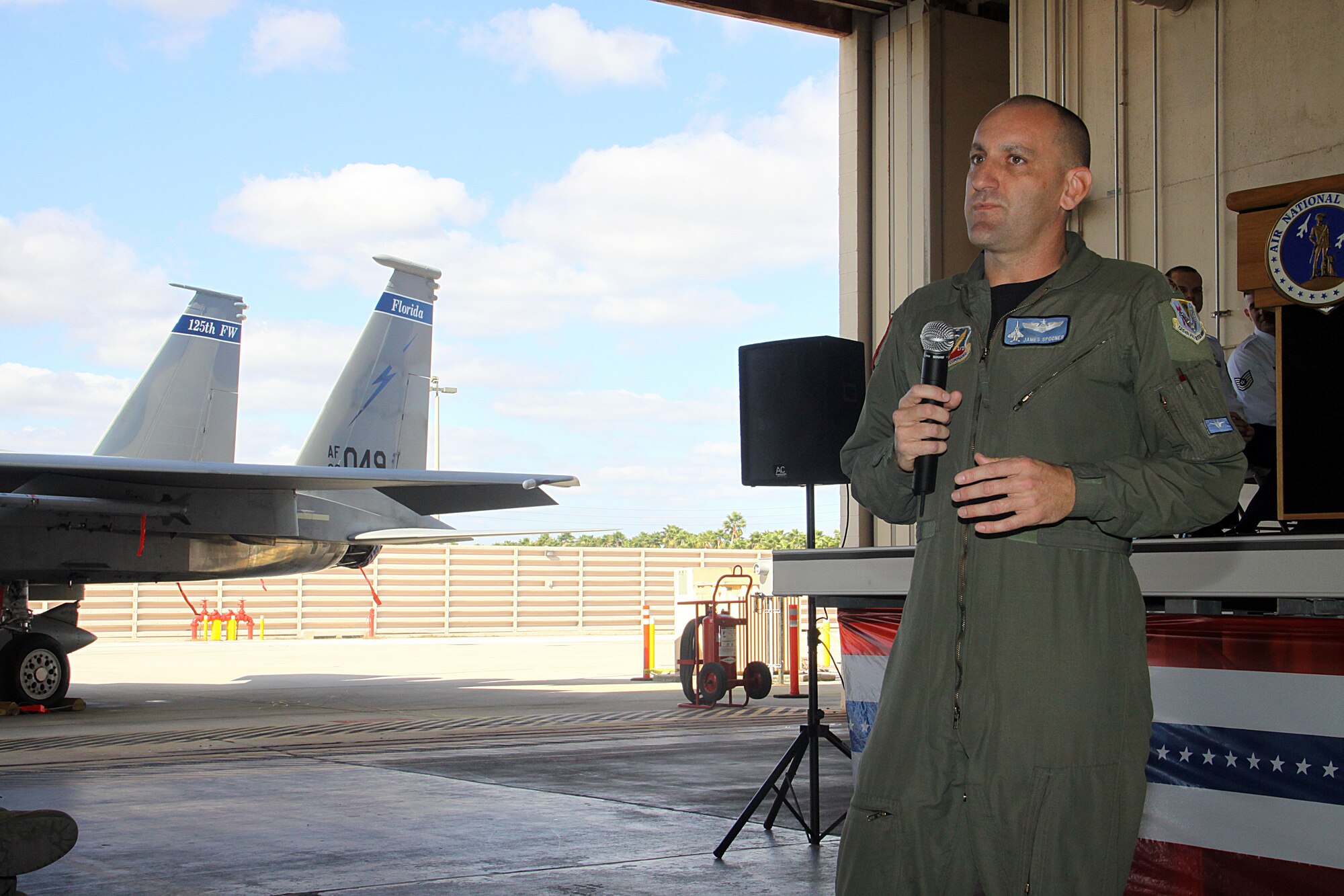 Maj. James Spooner addresses an audience of military members, family and friends after assuming command of Florida Air National Guard’s Detachment 1, 125th Fighter Wing on Dec 16. During a brief change of command ceremony Lt. Col. Michael Birkeland relinquished command to Maj. Spooner. The primary mission of Det. 1 is to provide the Continental NORAD Region (CONR) commander rapid response to invasions of the sovereign airspace of the United States and respond with appropriate defense measures against all hostile actions directed at the people and property of the United States. (U.S. Air Force photo/Tim Norton)