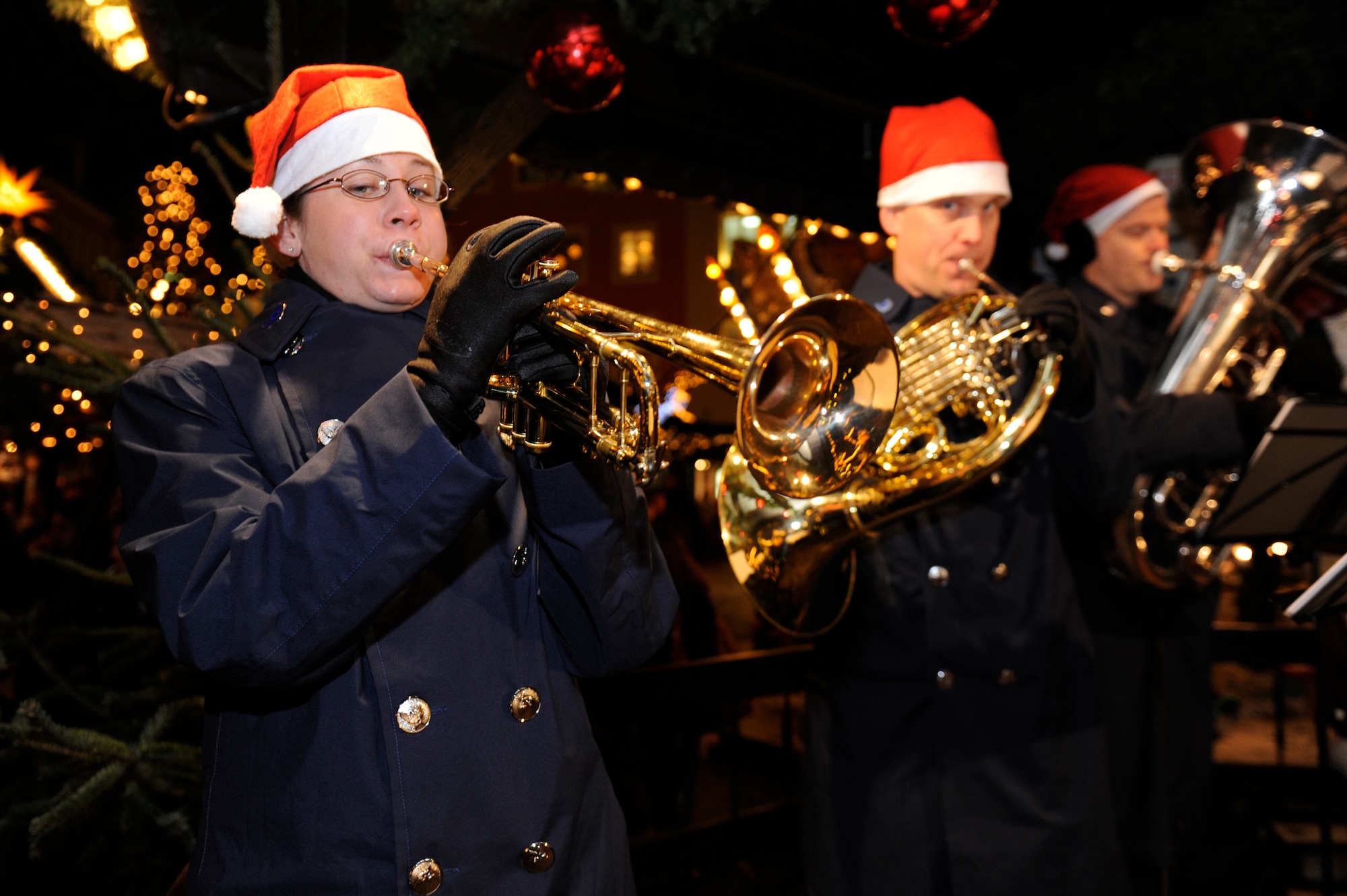 TRIER, Germany – Tech. Sgt. David Hartung, U.S. Air Forces in Europe Band tubaist and ensemble NCO in charge, performs with the Five Star Brass at the Trier Christmas Market Dec. 15. The USAFE Band played Christmas music in Trier and Bitburg to strengthen ties between U.S. and German neighbors in the area and is scheduled to perform on Spangdahlem Air Base at the commissary, J.R Rockers and the post office, Dec. 21. (U.S. Air Force photo/Master Sgt. Bill Gomez)