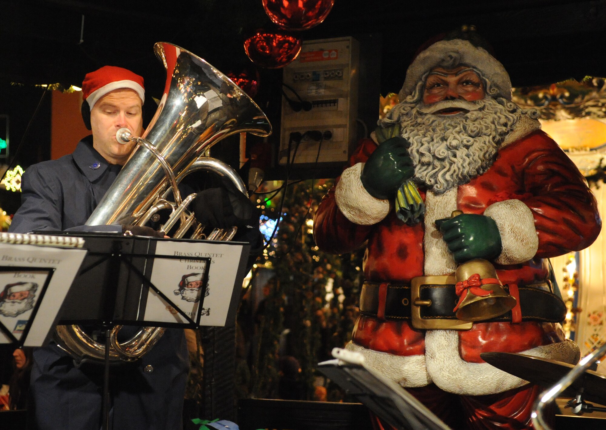 TRIER, Germany – Tech. Sgt. David Hartung, U.S. Air Forces in Europe Band tubaist and ensemble NCO in charge, performs with the Five Star Brass at the Trier Christmas Market Dec. 15. The USAFE Band played Christmas music in Trier and Bitburg to strengthen ties between U.S. and German neighbors in the area and is scheduled to perform on Spangdahlem Air Base at the commissary, J.R Rockers and the post office, Dec. 21. (U.S. Air Force photo/Staff Sgt. Benjamin Wilson)