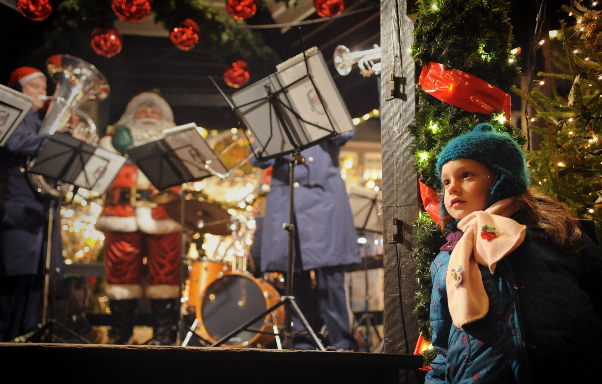 TRIER, Germany – A young girl watches as the U.S. Air Forces in Europe Band’s Five Star Brass ensemble performs at the Trier Christmas Market Dec. 15. The USAFE Band played Christmas music in Trier and Bitburg to strengthen ties between U.S. and German neighbors in the area and is scheduled to perform on Spangdahlem Air Base at the commissary, J.R Rockers and the post office, Dec. 21. (U.S. Air Force photo/Staff Sgt. Benjamin Wilson)
