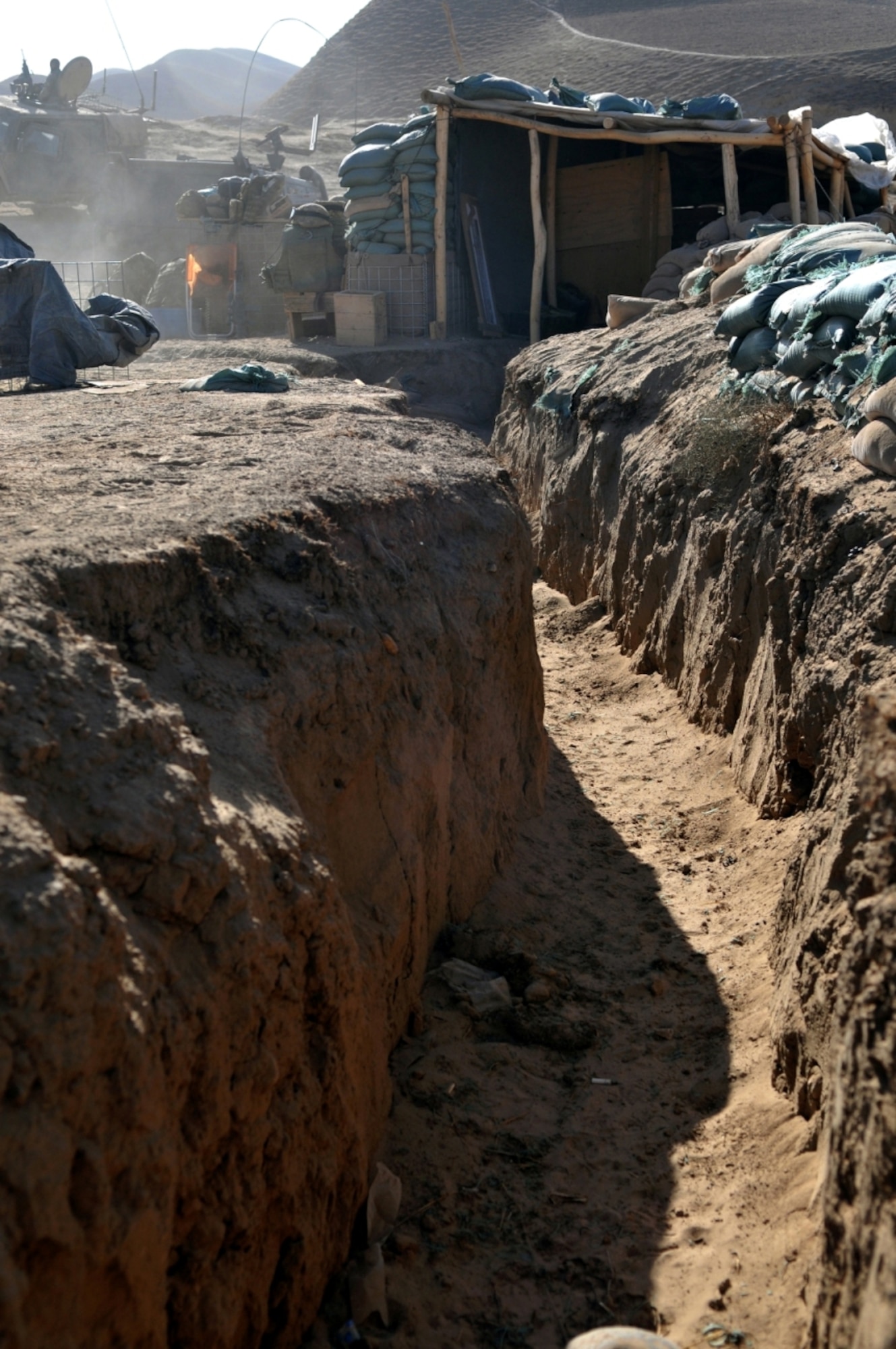 Italian and Afghan National Army soldiers dug trenches to live in and fight from at Combat Outpost Victor, Badghis province, Afghanistan. Servicemembers at COPs along the north and south border regions of the security bubble live a lifestyle not seen since World War I. Fighting from and living in trenches, these Soldiers fend of recurring attacks and struggle to maintain the bubble’s security and keep the villagers living inside the bubble safe from outside activities. (U.S. Air Force photo/Tech. Sgt. Kevin Wallace)