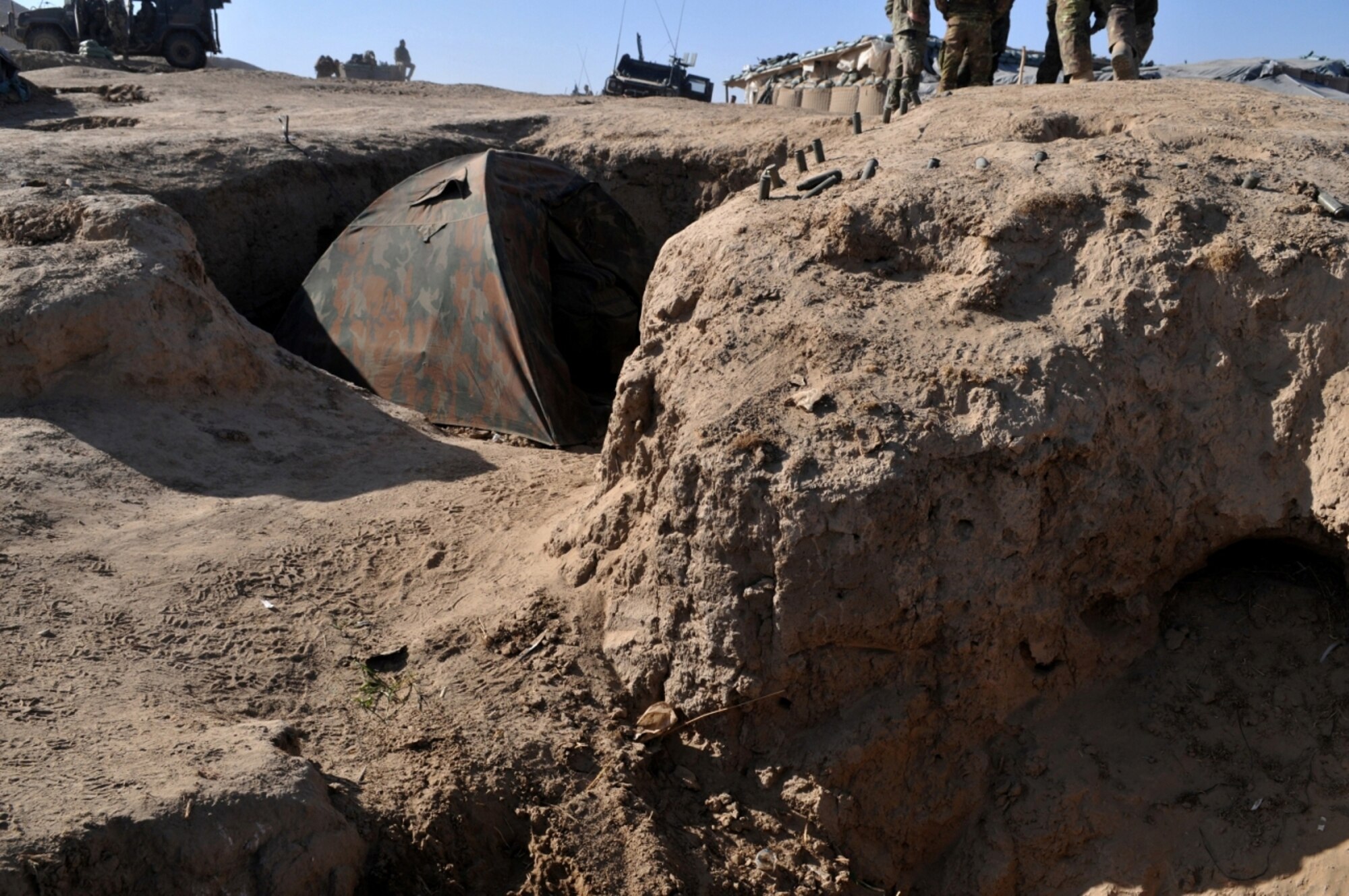 Italian and Afghan National Army soldiers dug trenches to live in and fight from at Combat Outpost Victor, Badghis province, Afghanistan. Servicemembers at COPs along the north and south border regions of the security bubble live a lifestyle not seen since World War I. Fighting from and living in trenches, these Soldiers fend of recurring attacks and struggle to maintain the bubble’s security and keep the villagers living inside the bubble safe from outside activities. (U.S. Air Force photo/Tech. Sgt. Kevin Wallace)