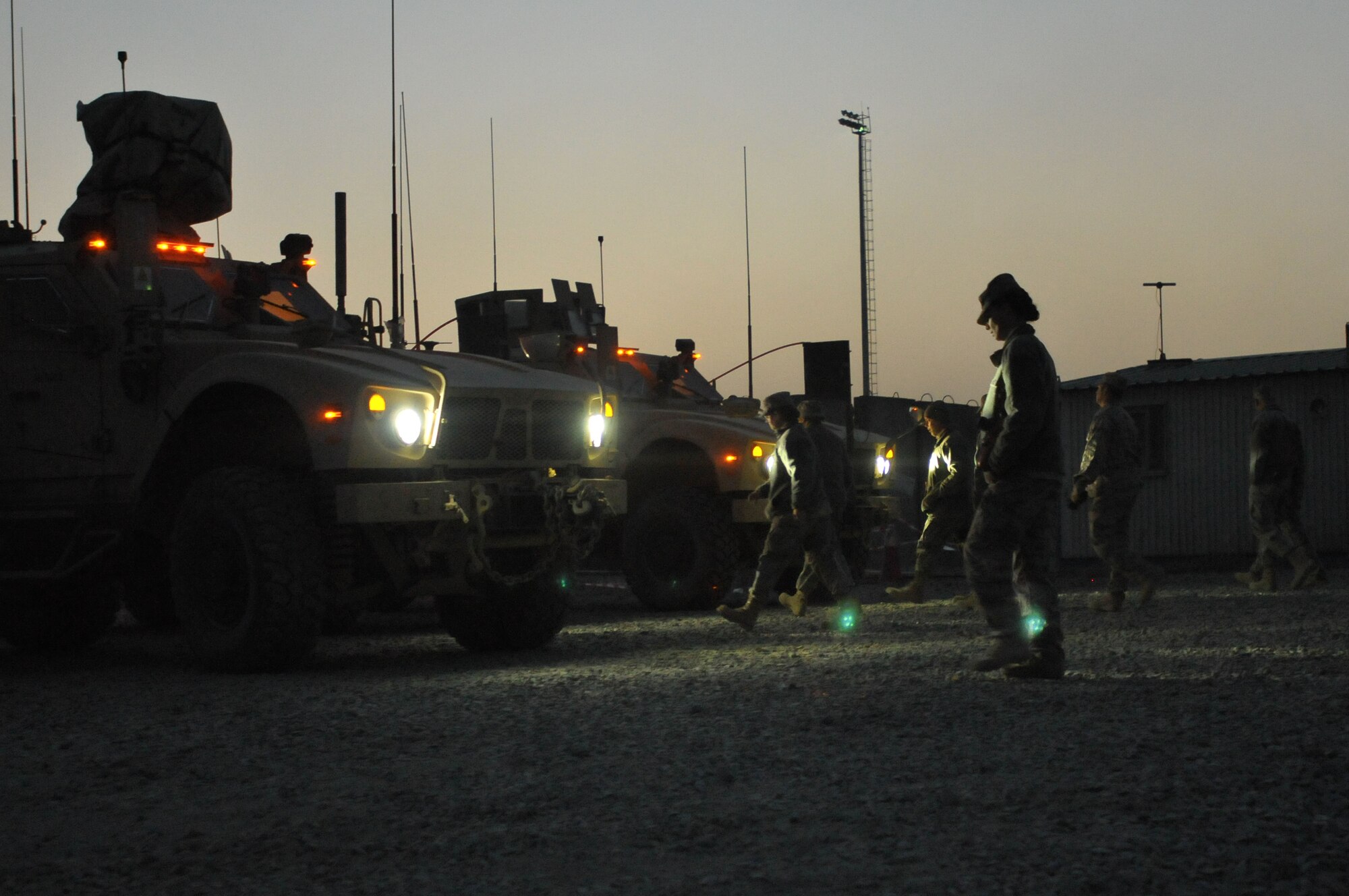 NATO Air Training Command-Afghanistan service members walk to their MRAP-All Terrain Vehicle during an M-ATV course at the Afghan Air Force Base in Kabul, Afghanistan. (Photo by MC2 Vladimir Potapenko/Released)