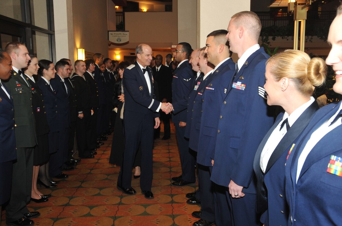 OMAHA, Neb. - Gen. Kevin P. Chilton, U.S. Strategic Command commander, shakes hands and greets enlisted servicemember's during his induction ceremony into the Strategic Order of the Sword and Shield Dec. 17.